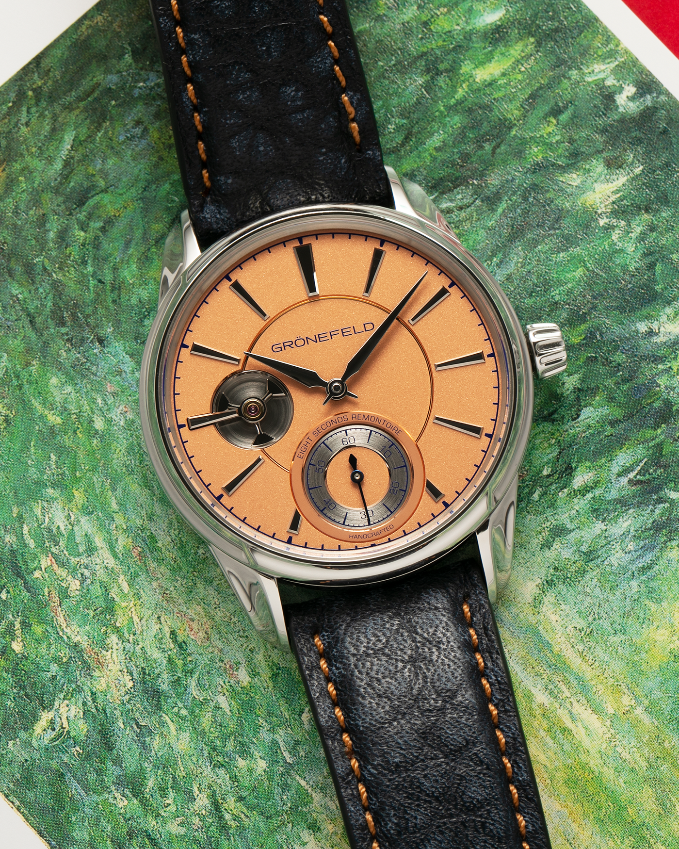 Brand: Grönefeld Year: XXXX Model: 1941 Remontoire ‘Salmon’ Material: Stainless Steel Movement: Grönefeld Cal. G-05, Manual-Winding Case Dimensions: 39.5mm x  10.5mm Lug Width: 20mm Strap: Grönefeld Blue Ostrich / Dutch Orange Leather Strap with Signed Stainless Steel 916L Tang Buckle