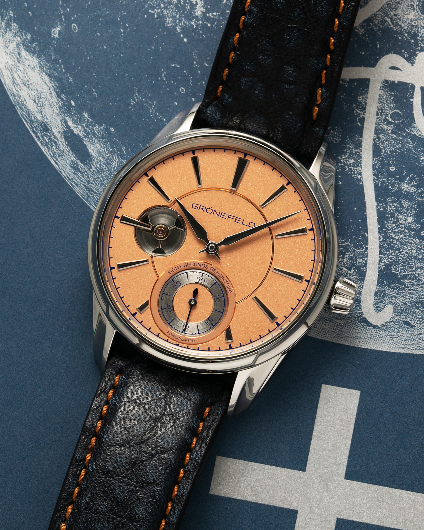 Brand: Grönefeld Year: XXXX Model: 1941 Remontoire ‘Salmon’ Material: Stainless Steel Movement: Grönefeld Cal. G-05, Manual-Winding Case Dimensions: 39.5mm x  10.5mm Lug Width: 20mm Strap: Grönefeld Blue Ostrich / Dutch Orange Leather Strap with Signed Stainless Steel 916L Tang Buckle
