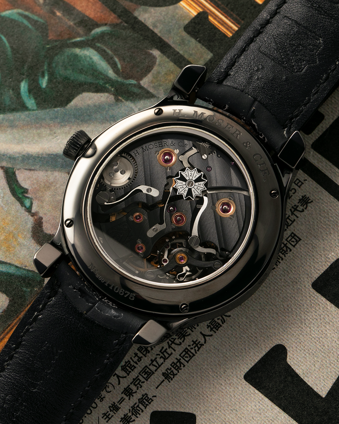 Brand: H. Moser & Cie
Year: Approximately 2016 (Guarantee Card Undated)
Model: Endeavour Perpetual Calendar Black Edition
Reference Number: 341.050-020
Material: DLC-Coated Grade 5 Titanium
Movement: H. Moser Cal. HMC 341, Manual-Winding
Case Dimensions: 40.8mm x 11.1 (Lug-to-Lug 47mm)
Lug Width: 20mm
Strap: H. Moser Black Calf Leather Strap with Signed DLC-Coated Titanium Tang Buckle