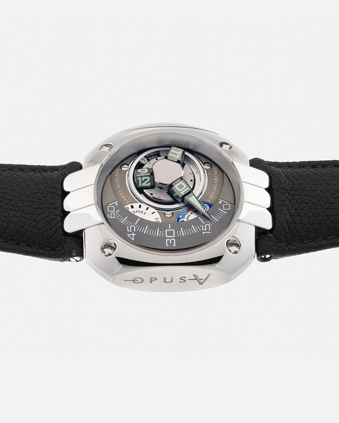 Brand: Harry Winston Year: 2005 Model: Opus V, Limited Edition of 45 pieces in Platinum Material: Platinum 950 Movement: Harry Winston Cal. HW1026 in ARCAP Alloy, Manual-Winding Case Diameter: 50mm Strap: Philips Grey Calf Leather Strap with Signed Platinum Tang Buckle