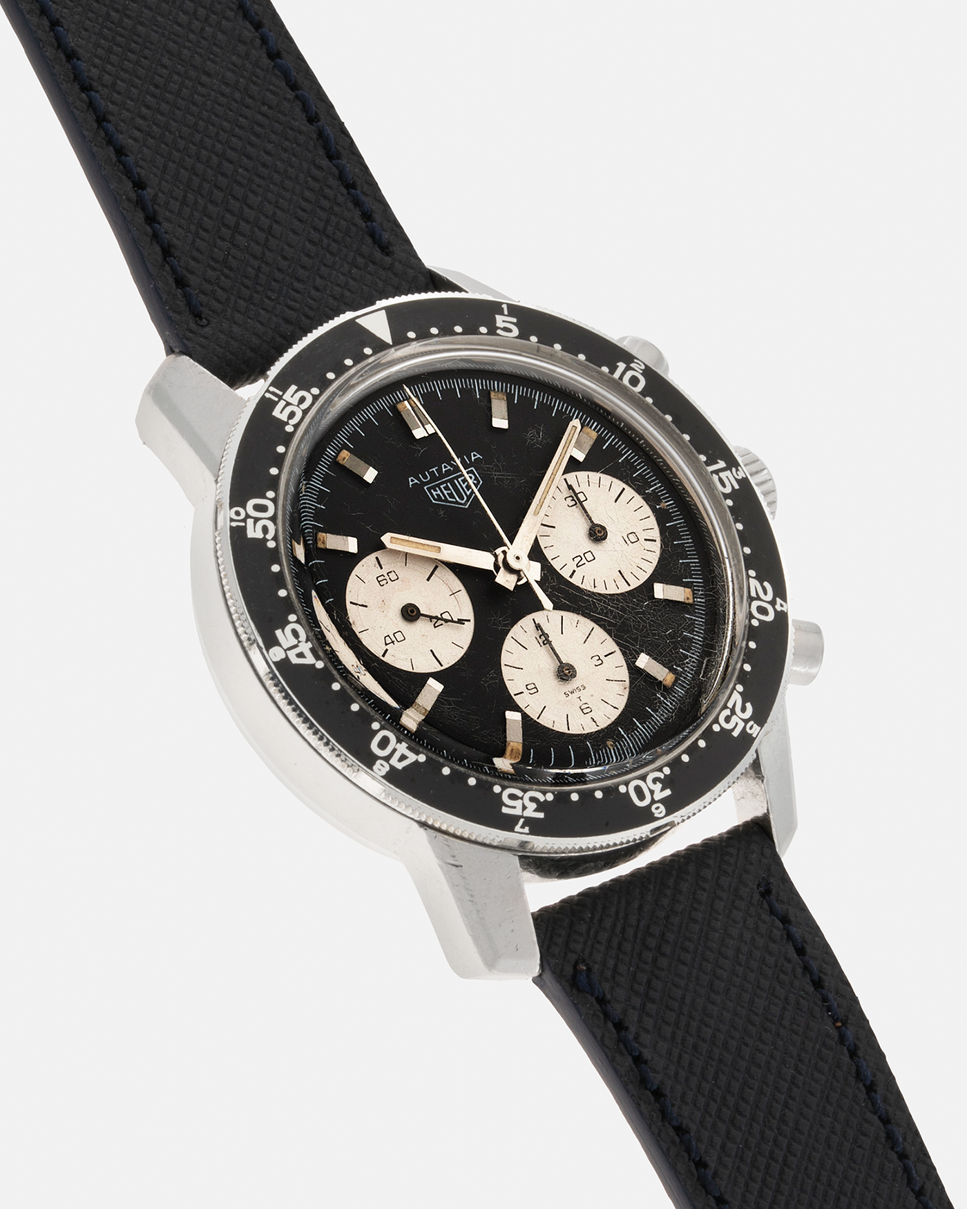 Brand: Heuer Year: 1960’s Model: Autavia Reference Number: 2446C MH (Compressor Case, Minute Hour Bezel) Serial Number: 108644 Material: Stainless Steel Movement: Valjoux Cal. 72, Manual-Winding Case Diameter: 40mm Lug Width: 20mm Strap: Molequin Navy Textured Calf Leather Strap