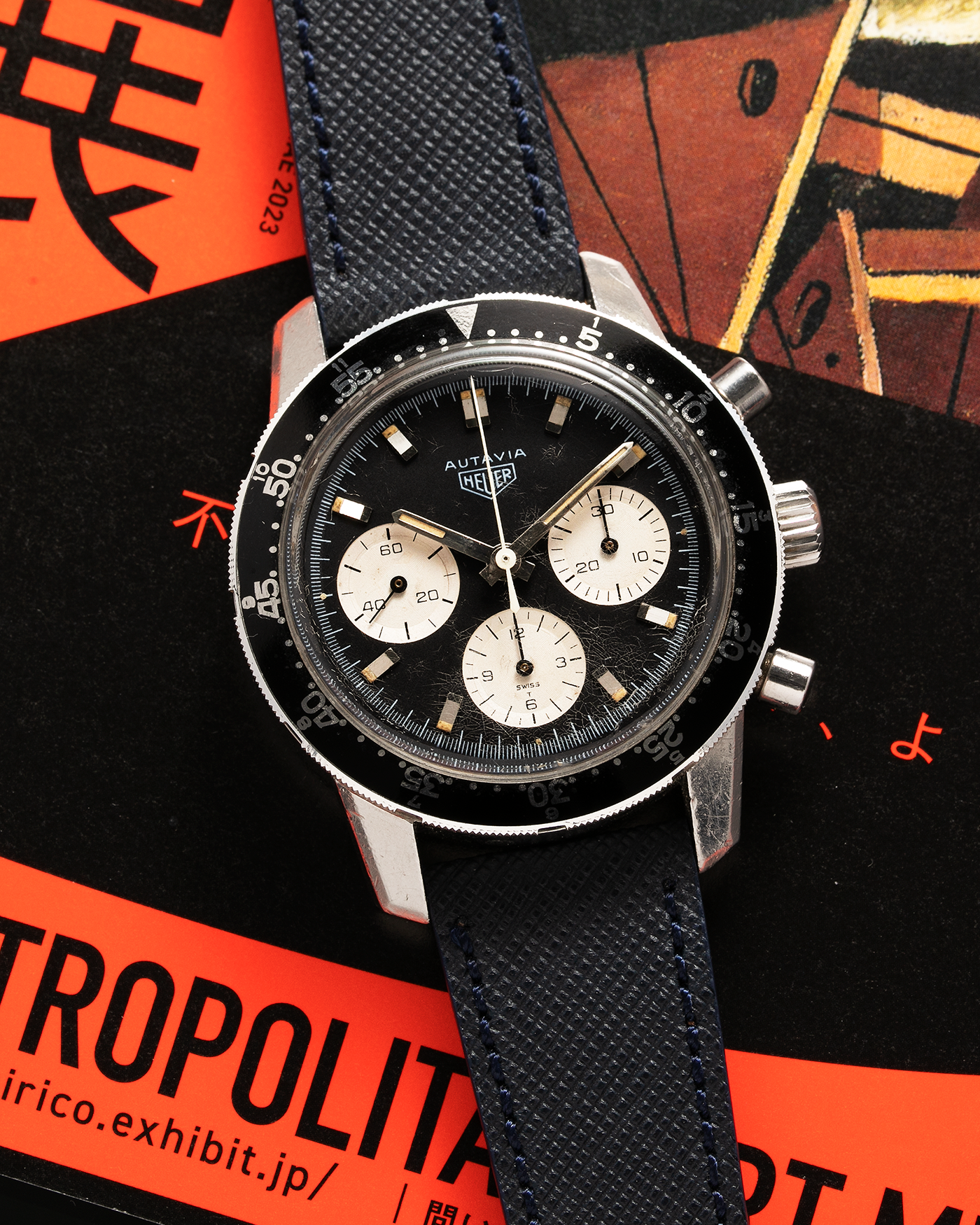 Brand: Heuer Year: 1960’s Model: Autavia Reference Number: 2446C MH (Compressor Case, Minute Hour Bezel) Serial Number: 108644 Material: Stainless Steel Movement: Valjoux Cal. 72, Manual-Winding Case Diameter: 40mm Lug Width: 20mm Strap: Molequin Navy Textured Calf Leather Strap