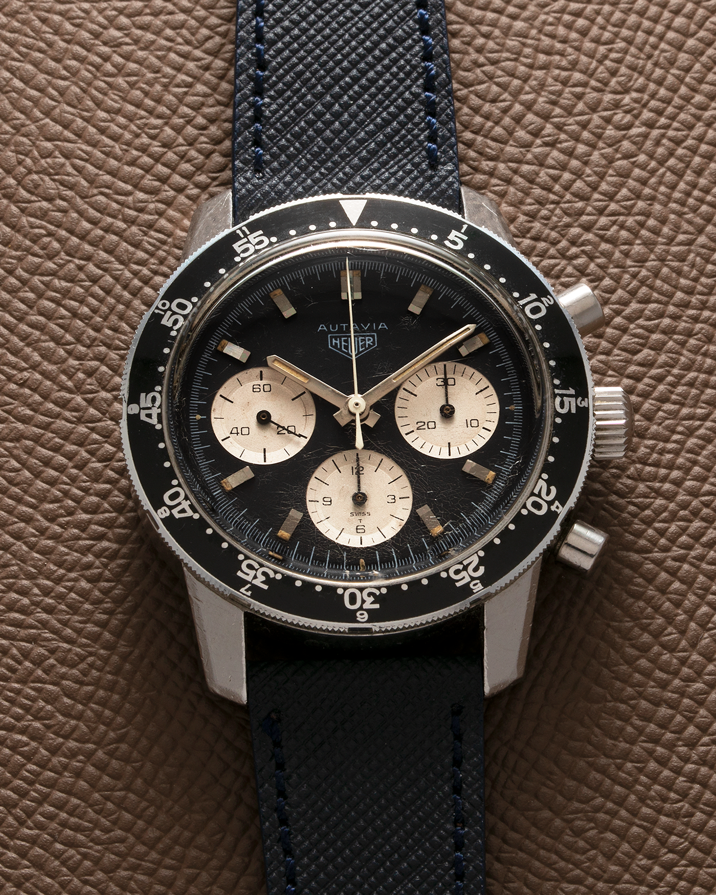 Brand: Heuer Year: 1960’s Model: Autavia Reference Number: 2446C MH (Compressor Case, Minute Hour Bezel) Serial Number: 108644 Material: Stainless Steel Movement: Valjoux Cal. 72, Manual-Winding Case Diameter: 40mm Lug Width: 20mm Strap: Molequin Navy Textured Calf Leather Strap