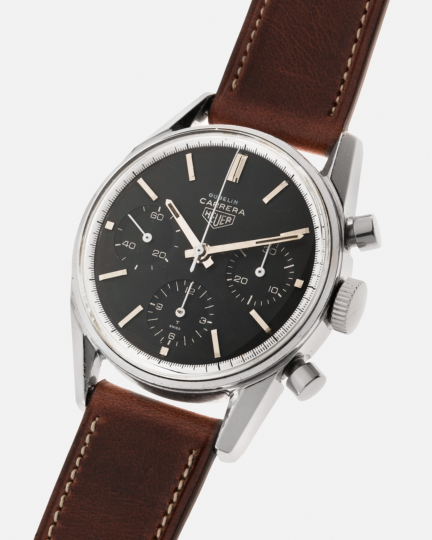 Brand: Heuer Year: 1960’s Model: Carrera Reference Number: 2447N Serial Number: 69XXX Material: Stainless Steel Movement: Valjoux 72 Case Diameter: 36mm Lug Width: 18mm Strap: Nostime Medium Brown Calf Leather Strap with Stainless Steel Tang Buckle