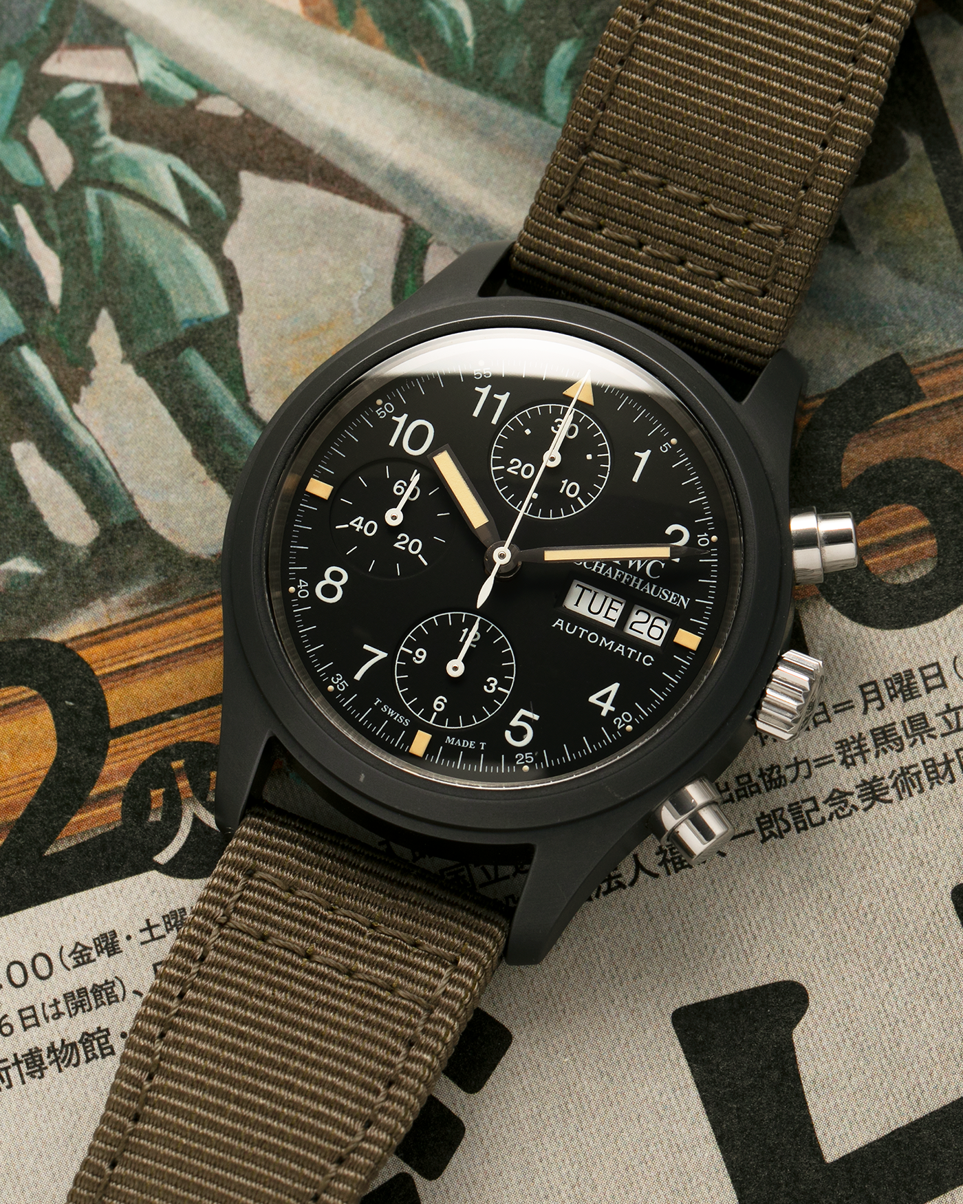 Brand: IWC
Year: Mid-1990s
Model: Fliegerchronograph ‘Keramik’
Reference: 3705
Material: Ceramic and Stainless Steel Case
Movement: Valjoux Cal. 7750 (Modified by IWC), Self-Winding
Case Dimensions: 39mm x 14.8mm (47.7mm Lug-to-Lug)
Lug Width: 20mm
Strap: IWC Army Green Canvas Strap with Signed Stainless Steel Tang Buckle