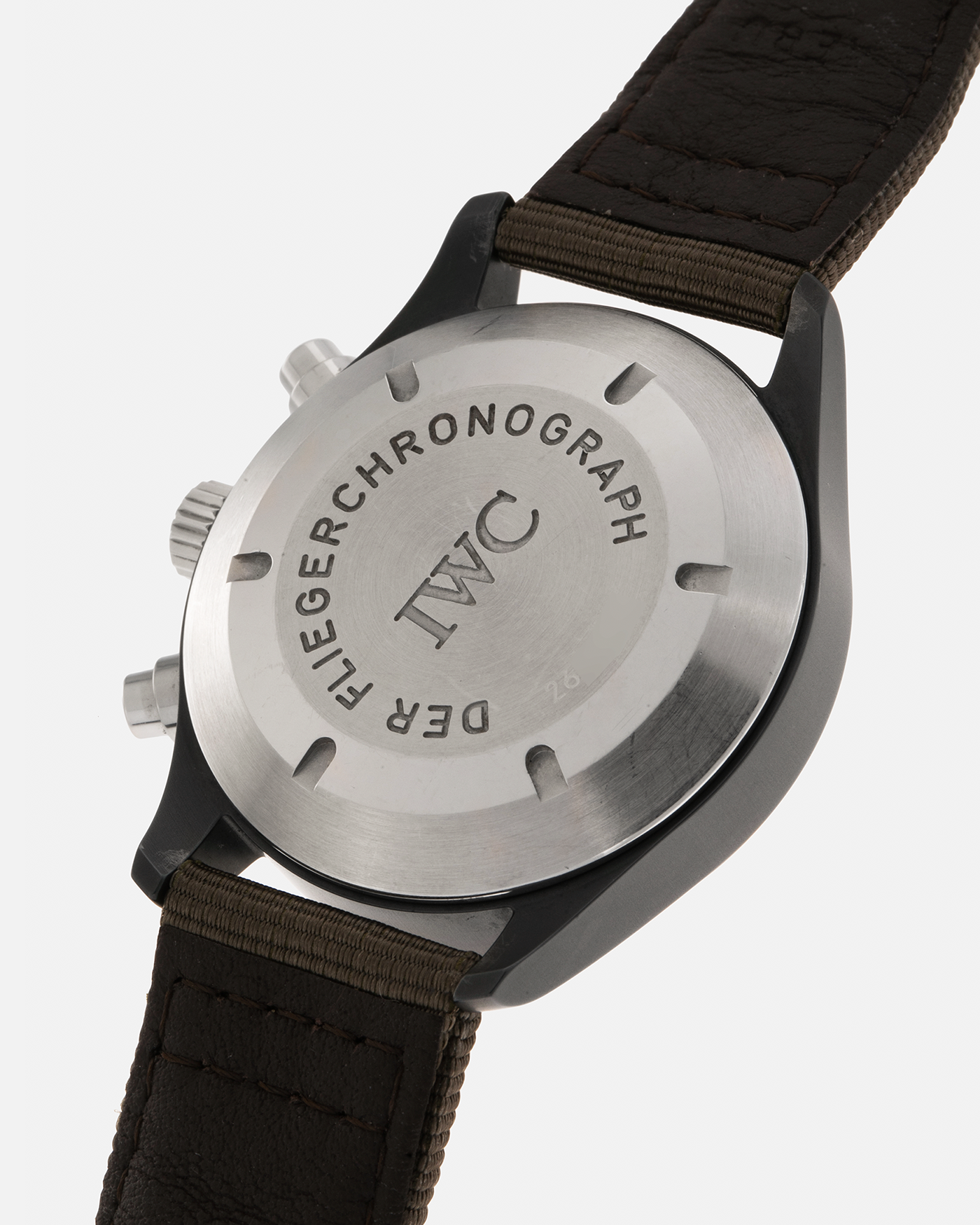 Brand: IWC
Year: Mid-1990s
Model: Fliegerchronograph ‘Keramik’
Reference: 3705
Material: Ceramic and Stainless Steel Case
Movement: Valjoux Cal. 7750 (Modified by IWC), Self-Winding
Case Dimensions: 39mm x 14.8mm (47.7mm Lug-to-Lug)
Lug Width: 20mm
Strap: IWC Army Green Canvas Strap with Signed Stainless Steel Tang Buckle