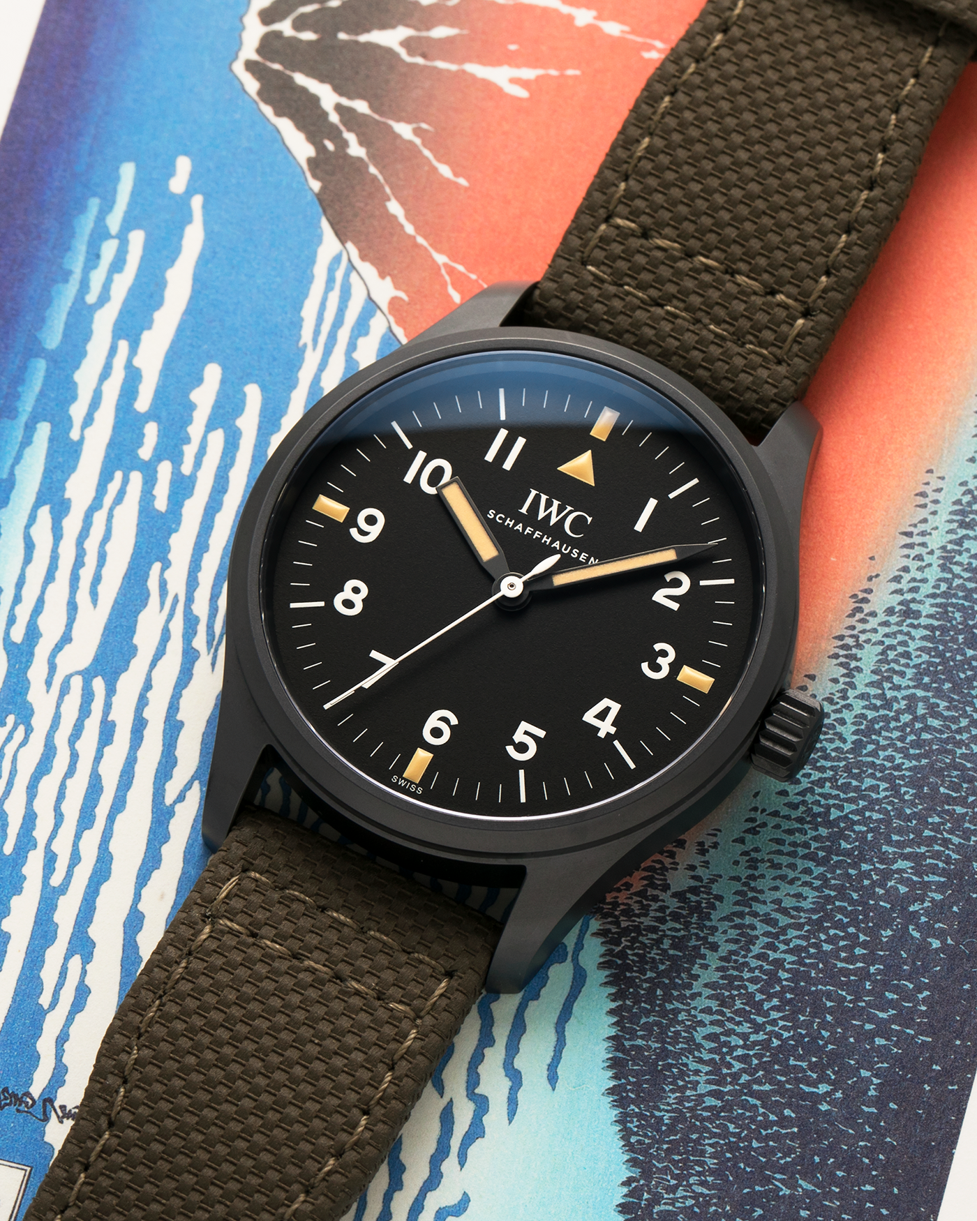 Brand: IWC
Year: 2019
Model: Mark XVIII ‘Hodinkee’, Limited to 500 pieces
Reference Number: IW324801
Material: Ceratanium
Movement: IWC Cal. 35100, Self-Winding
Case Dimensions: 39mm x 10.6mm (Lug-to-Lug 48mm)
Lug Width: 20mm
Strap: IWC Dark Olive Textile Strap with Signed Ceratanium Tang Buckle