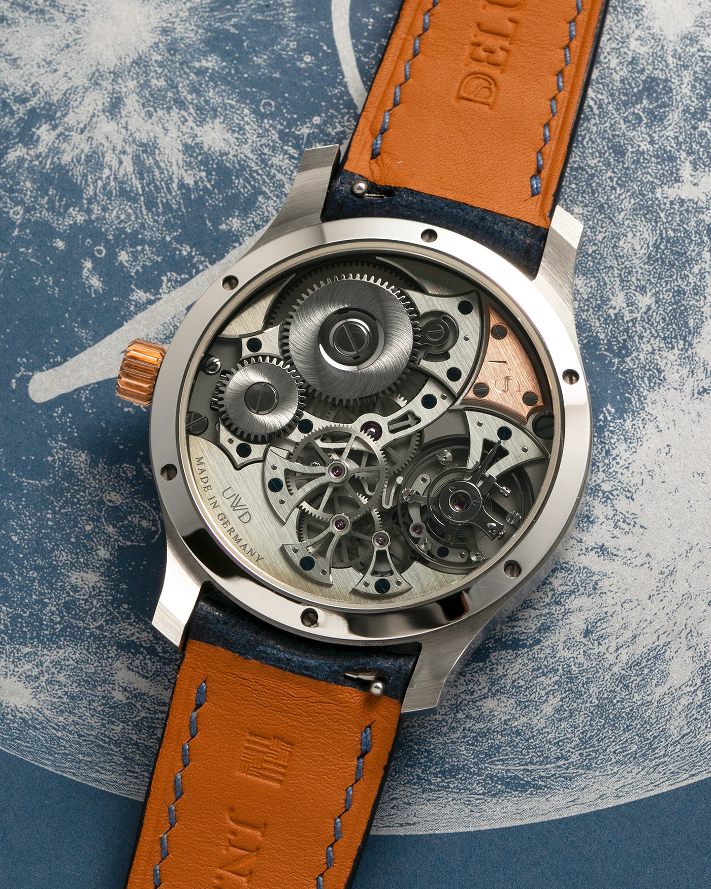 Brand: J.N. Shapiro
Year: 2023
Model: Infinity Series 1.5
Serial Number: S.1
Material: Stainless Steel Case, Black Zirconium Dial, Rose Gold Hands, Crown and Inlays
Movement: UWD Cal. 33.1, Manual-Winding
Case Dimensions: 39mm x 9.75mm (47mm Lug-to-Lug)
Lug Width: 20mm
Strap: J.N. Shapiro x Delugs Navy Blue Leather Strap with Signed Stainless Steel Tang Buckle