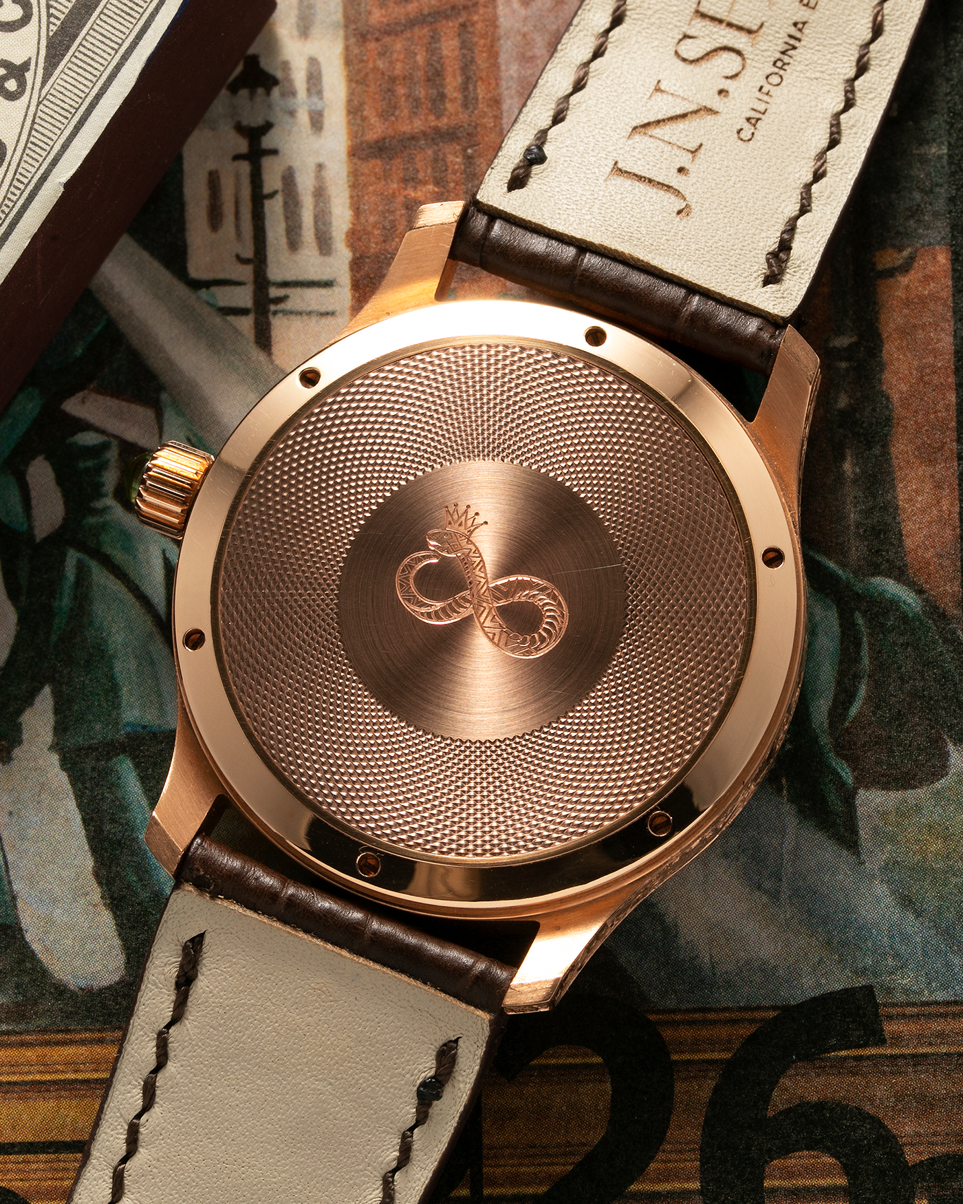Brand: J.N. Shapiro Year: 2020 Model: Infinity Series (Piece Unique) Material: 18-carat Rose Gold Case, Ruthenium Dial Movement: UWD Cal. 33.1, Manual-Winding Case Diameter: 40mm Lug Width: 22mm Strap: J.N. Shapiro Dark Brown Alligator Strap with Custom Engraved 18-carat Rose Gold Tang Buckle