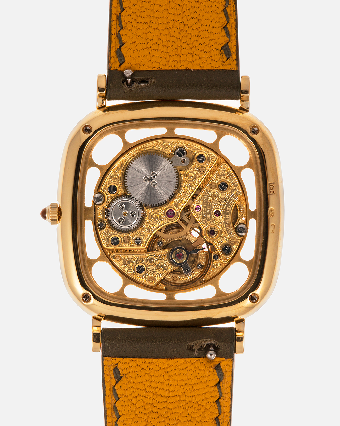 Brand: Jaeger-LeCoultre
Reference: 141.007.1 Skeleton
Year: 1981
Material: 18-carat Yellow Gold Case, 14-Carat Yellow Gold Movement, Tiger Eye Cabochon
Movement: Jaeger-LeCoultre Cal. 839, Skeletonized and Manual-Winding
Case Dimensions: 33mm x 4.9mm (Lug-to-Lug 38mm)
Lug Width: 18mm
Strap: Custom Olive Green Calf Leather Strap with Mustard-Yellow Underlining