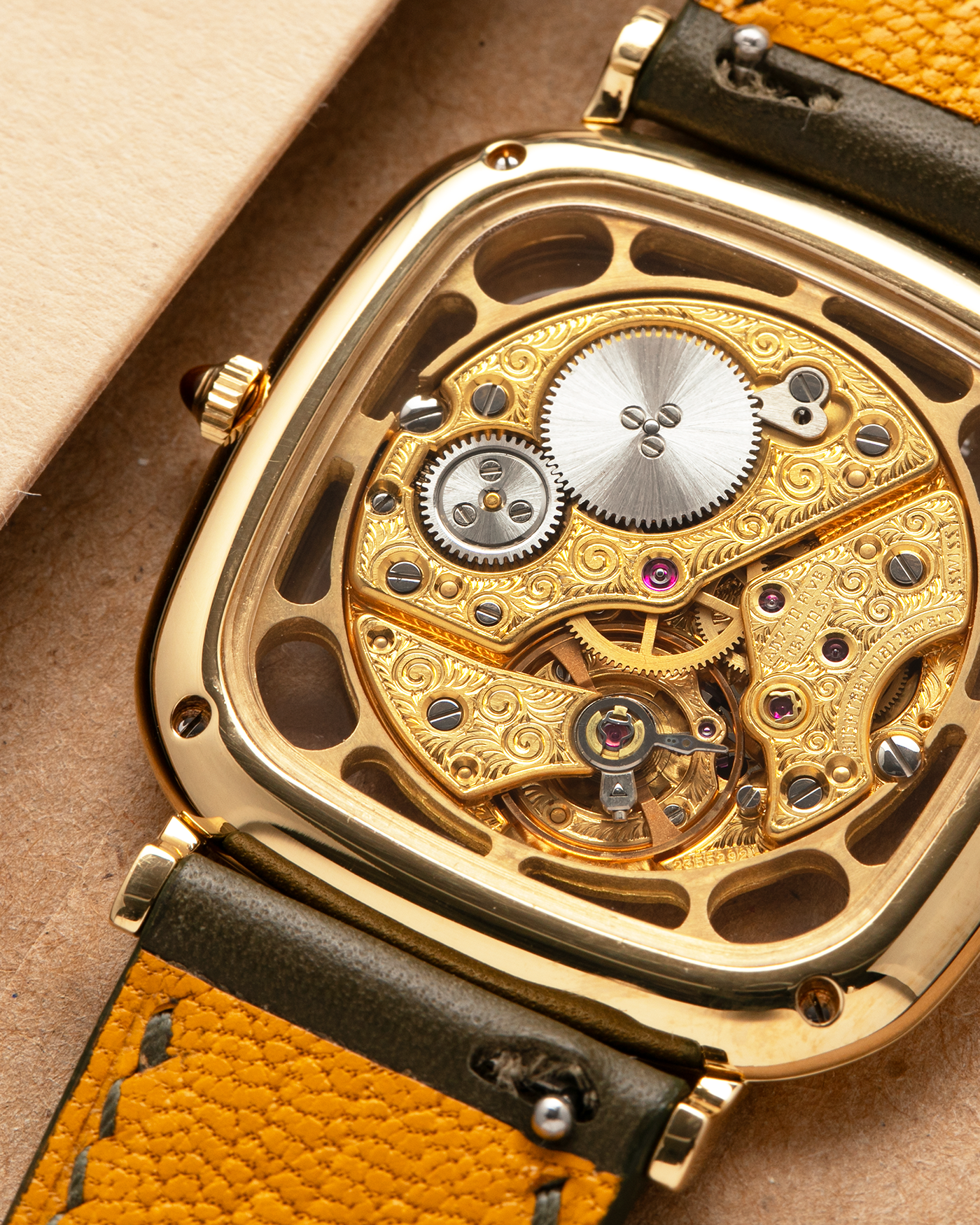 Brand: Jaeger-LeCoultre
Reference: 141.007.1 Skeleton
Year: 1981
Material: 18-carat Yellow Gold Case, 14-Carat Yellow Gold Movement, Tiger Eye Cabochon
Movement: Jaeger-LeCoultre Cal. 839, Skeletonized and Manual-Winding
Case Dimensions: 33mm x 4.9mm (Lug-to-Lug 38mm)
Lug Width: 18mm
Strap: Custom Olive Green Calf Leather Strap with Mustard-Yellow Underlining