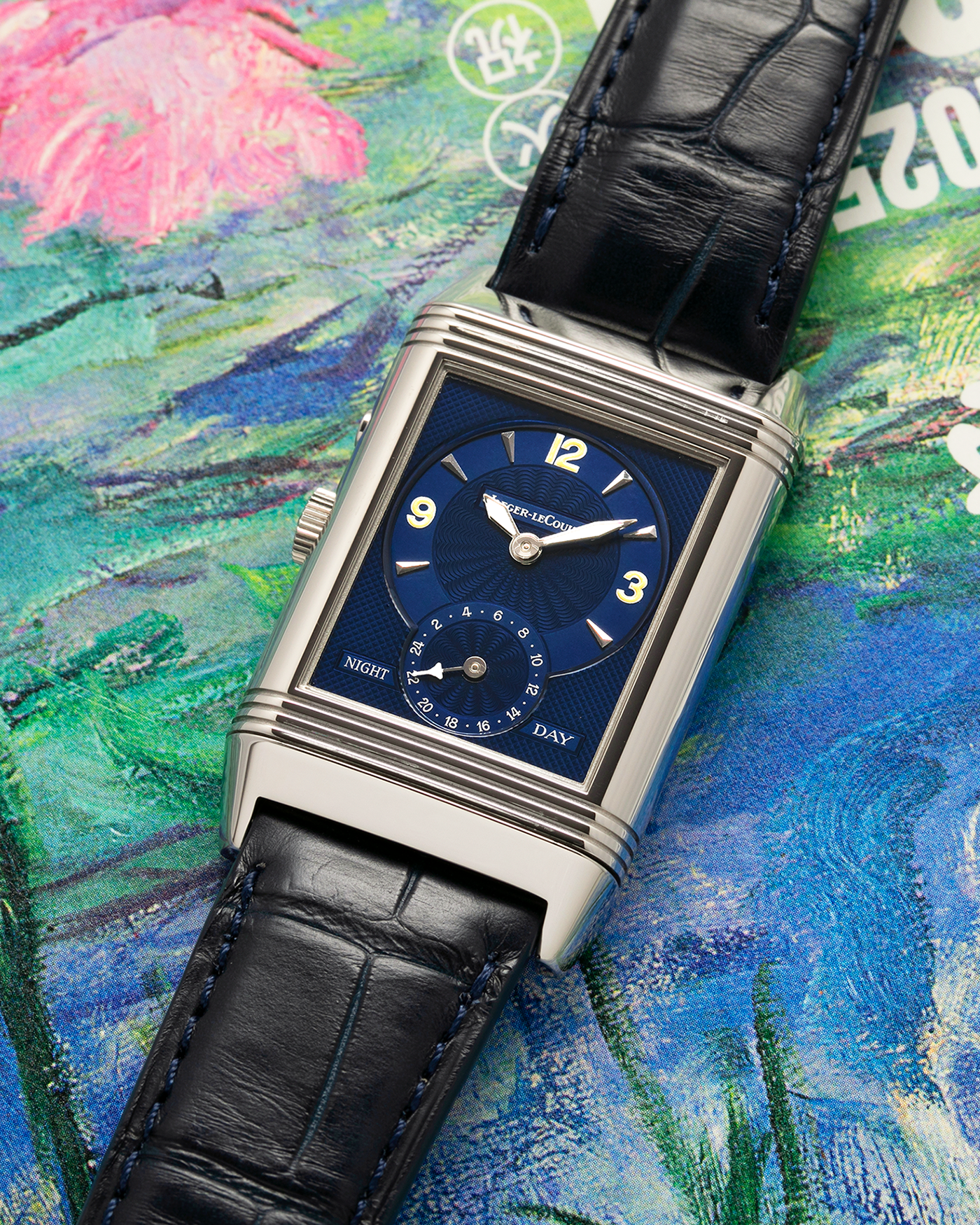 Brand: Jaeger LeCoultre
Year: Late 1990s
Model: Reverso Duoface Japan Edition Blue, Limited Edition of 300 Pieces
Reference Number: 270.8.54
Material: Stainless Steel
Movement: Jaeger LeCoultre Cal. 854, Manual-Wind
Case Dimensions: 42mm (Including Lugs) x 26mm
Lug Width: 19mm
Strap: Jaeger LeCoultre Black Alligator Leather Strap with Signed Stainless Steel Deployant Clasp