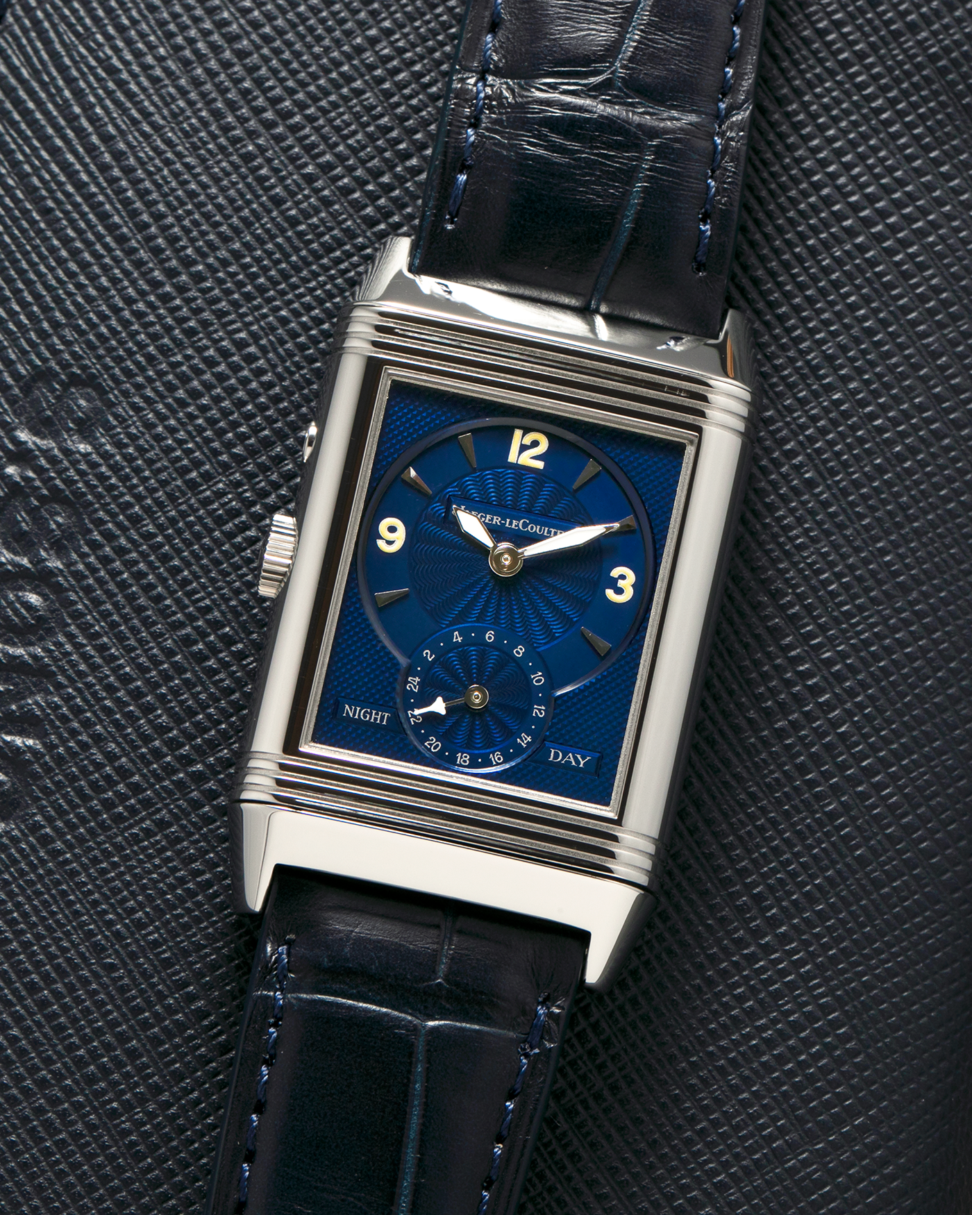 Brand: Jaeger LeCoultre
Year: Late 1990s
Model: Reverso Duoface Japan Edition Blue, Limited Edition of 300 Pieces
Reference Number: 270.8.54
Material: Stainless Steel
Movement: Jaeger LeCoultre Cal. 854, Manual-Wind
Case Dimensions: 42mm (Including Lugs) x 26mm
Lug Width: 19mm
Strap: Jaeger LeCoultre Black Alligator Leather Strap with Signed Stainless Steel Deployant Clasp