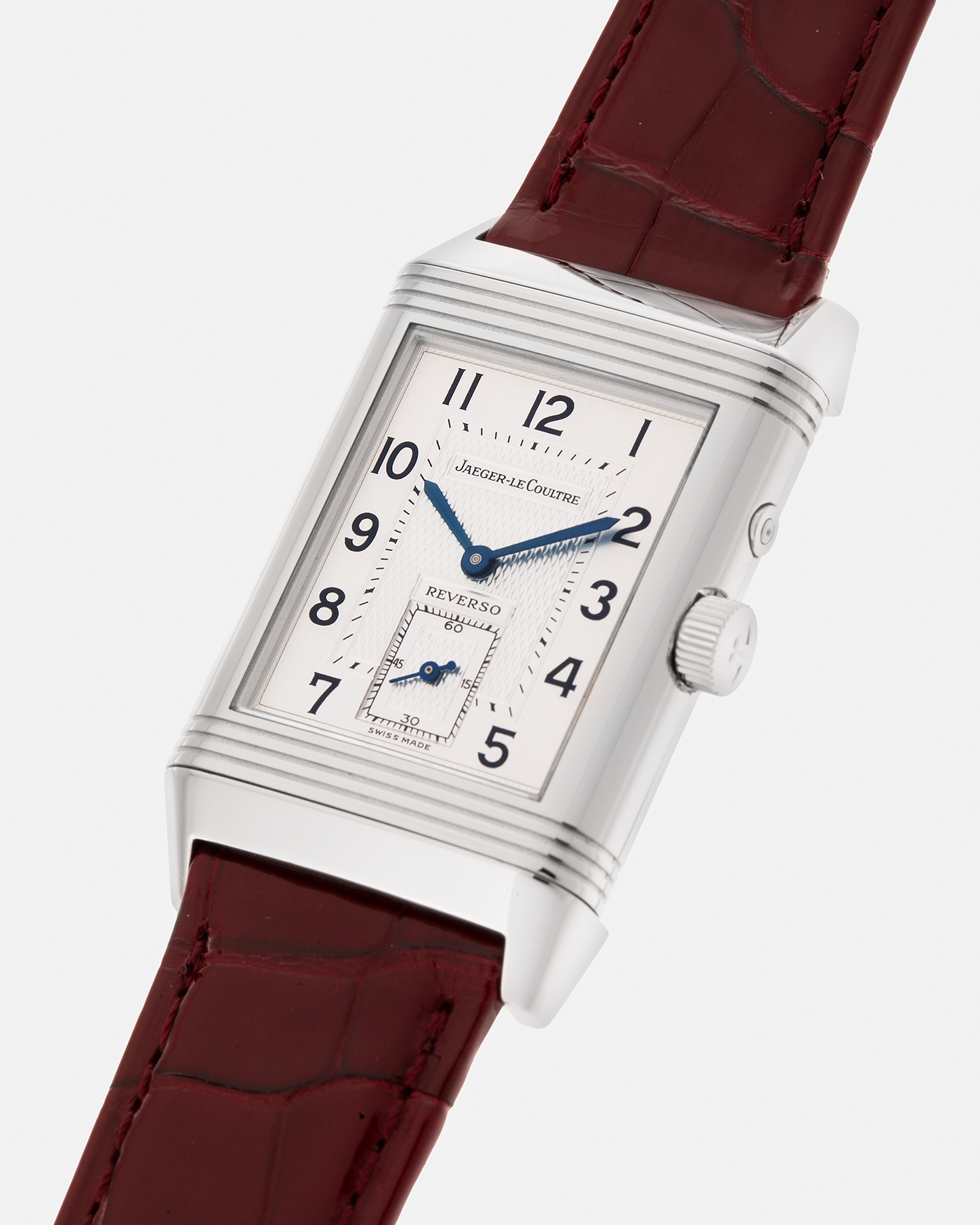 Brand: Jaeger LeCoultre
Year: Late 1990s
Model: Reverso Duoface Japan Edition Red, Limited Edition of 300 Pieces
Reference Number: 270.8.54
Material: Stainless Steel
Movement: Jaeger LeCoultre Cal. 854, Manual-Wind
Case Dimensions: 42mm (Including Lugs) x 26mm
Lug Width: 19mm
Strap: Jaeger LeCoultre Burgundy Red Alligator Leather Strap with Signed Stainless Steel Deployant Clasp
