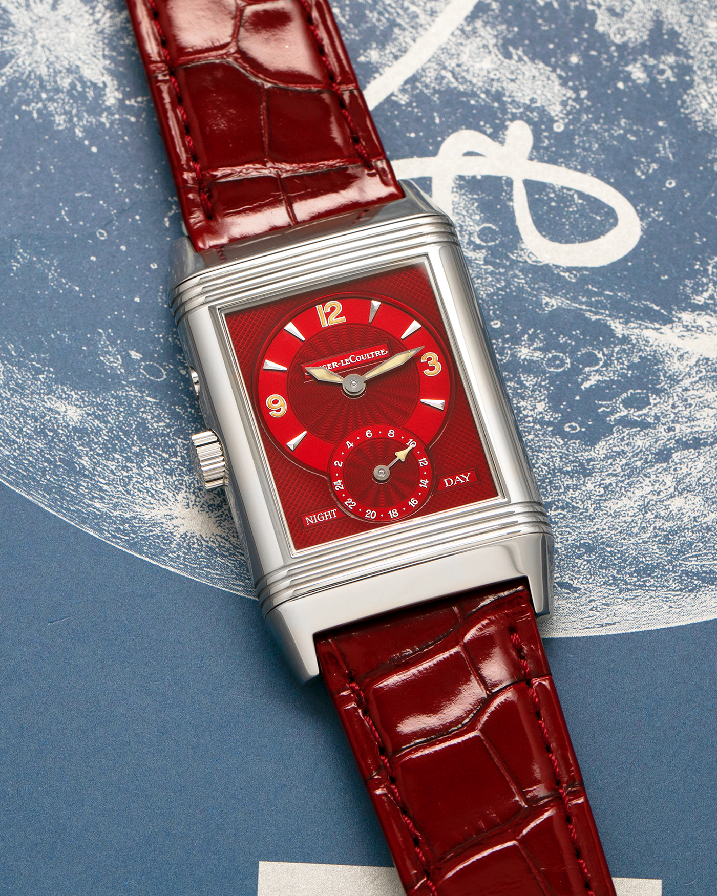 Brand: Jaeger LeCoultre
Year: Late 1990s
Model: Reverso Duoface Japan Edition Red, Limited Edition of 300 Pieces
Reference Number: 270.8.54
Material: Stainless Steel
Movement: Jaeger LeCoultre Cal. 854, Manual-Wind
Case Dimensions: 42mm (Including Lugs) x 26mm
Lug Width: 19mm
Strap: Jaeger LeCoultre Burgundy Red Alligator Leather Strap with Signed Stainless Steel Deployant Clasp