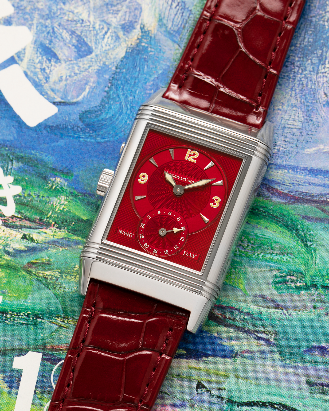 Brand: Jaeger LeCoultre
Year: Late 1990s
Model: Reverso Duoface Japan Edition Red, Limited Edition of 300 Pieces
Reference Number: 270.8.54
Material: Stainless Steel
Movement: Jaeger LeCoultre Cal. 854, Manual-Wind
Case Dimensions: 42mm (Including Lugs) x 26mm
Lug Width: 19mm
Strap: Jaeger LeCoultre Burgundy Red Alligator Leather Strap with Signed Stainless Steel Deployant Clasp
