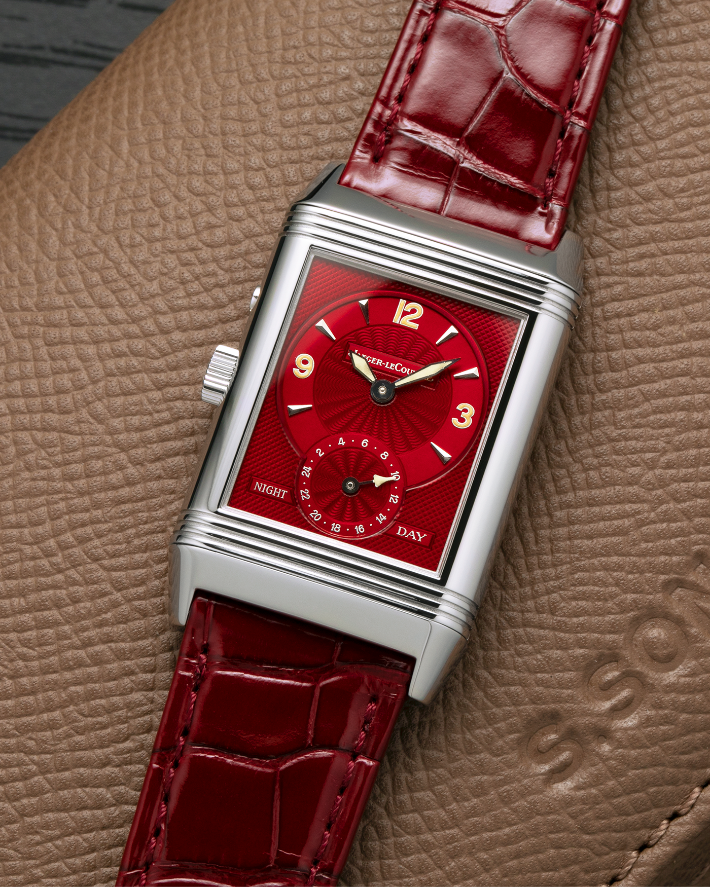 Brand: Jaeger LeCoultre
Year: Late 1990s
Model: Reverso Duoface Japan Edition Red, Limited Edition of 300 Pieces
Reference Number: 270.8.54
Material: Stainless Steel
Movement: Jaeger LeCoultre Cal. 854, Manual-Wind
Case Dimensions: 42mm (Including Lugs) x 26mm
Lug Width: 19mm
Strap: Jaeger LeCoultre Burgundy Red Alligator Leather Strap with Signed Stainless Steel Deployant Clasp