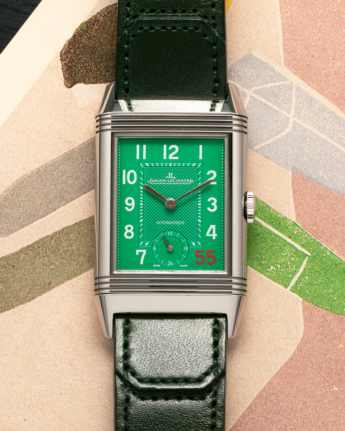 Brand: Jaeger LeCoultre
Year: 2020
Model: Grande Reverso 976 ‘55th Anniversary of Kuwait’, Limited Edition of 55 Pieces
Reference: 278.8.56
Material: Stainless Steel
Movement: Jaeger LeCoultre Cal. 967B, Self-Winding
Case Dimensions: 46mm (Including Lugs) x 27mm x 9mm
Lug Width: 20mm
Strap: Jaeger LeCoultre Casa Fagliano Olive Green Leather Strap with Signed Stainless Steel Deployant Clasp
