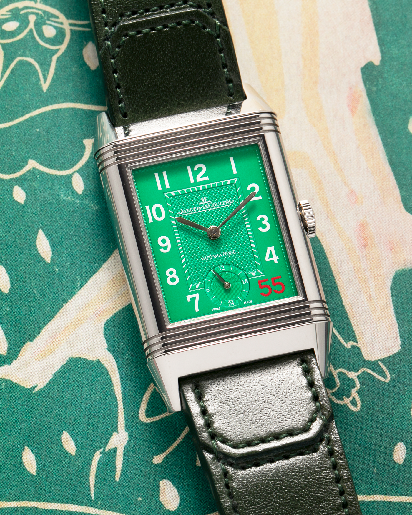 Brand: Jaeger LeCoultre
Year: 2020
Model: Grande Reverso 976 ‘55th Anniversary of Kuwait’, Limited Edition of 55 Pieces
Reference: 278.8.56
Material: Stainless Steel
Movement: Jaeger LeCoultre Cal. 967B, Self-Winding
Case Dimensions: 46mm (Including Lugs) x 27mm x 9mm
Lug Width: 20mm
Strap: Jaeger LeCoultre Casa Fagliano Olive Green Leather Strap with Signed Stainless Steel Deployant Clasp
