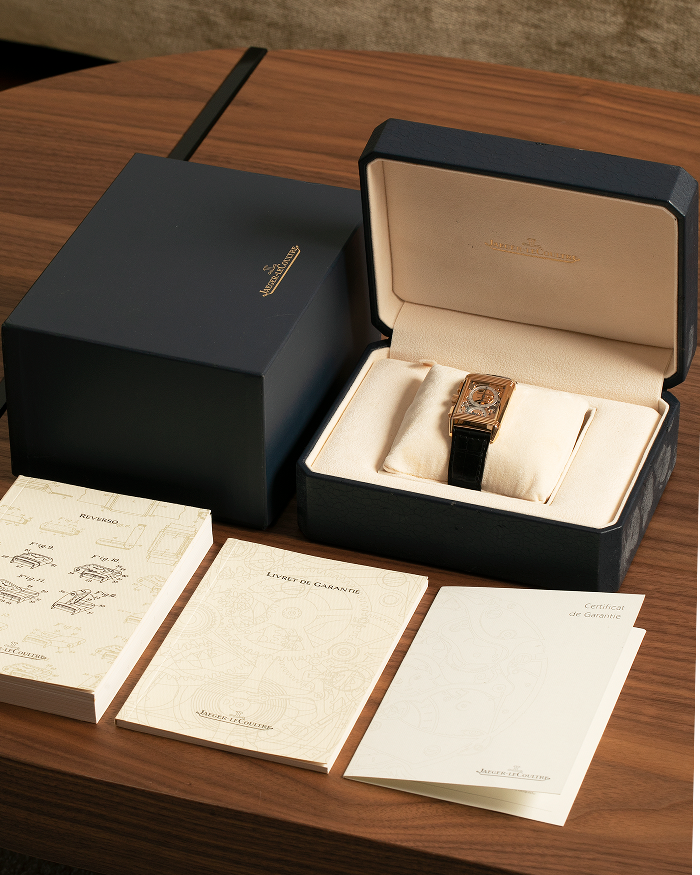 Brand: Jaeger LeCoultre
Year: 1996
Model: Reverso Chronograph Retrograde, Limited to 500 pieces
Reference: 270.2.69
Material: 18-carat Rose Gold
Movement: Jaeger LeCoultre Cal. 829, Manual-Wind
Case Dimensions: 42mm (Including Lugs) x 26mm x 9.5mm
Lug Width: 19mm
Strap: Jaeger-LeCoultre Black Alligator Leather Strap with Signed 18-carat Rose Gold Deployant Clasp