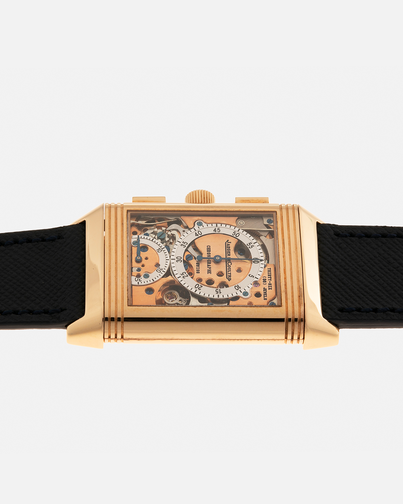 Brand: Jaeger LeCoultre Year: 1996 Model: Reverso Chronographe Retrograde, Limited to 500 pieces Reference: 270.2.69 Material: 18-carat Rose Gold Movement: Jaeger LeCoultre Cal. 829, Manual-Wind Case Dimensions: 42mm x 26mm x 9.5mm Lug Width: 19mm Strap: Molequin Navy Blue Textured Calf with Signed 18-carat Rose Gold Deployant Clasp