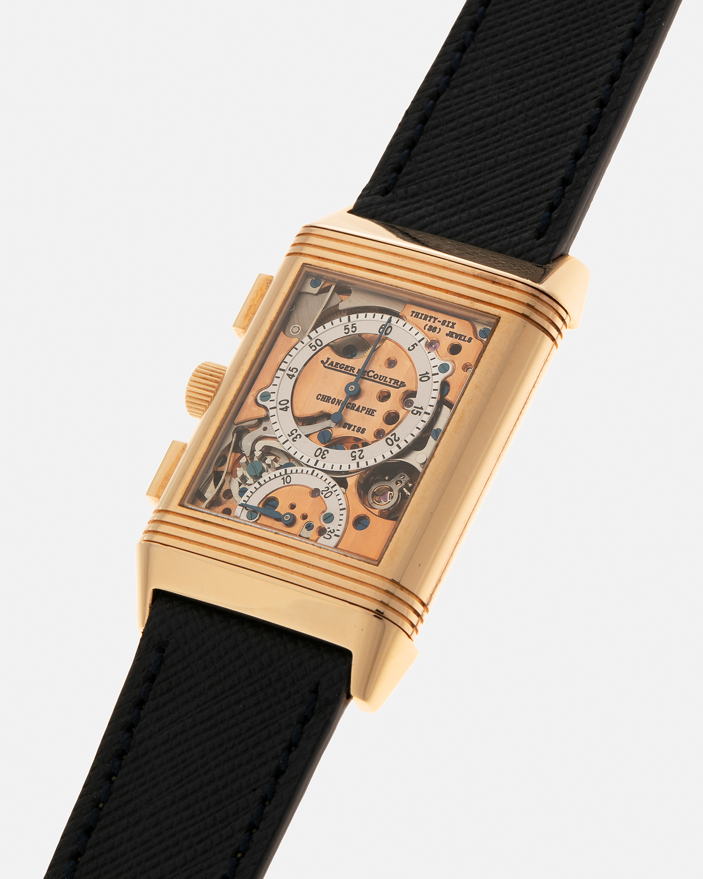 Brand: Jaeger LeCoultre Year: 1996 Model: Reverso Chronographe Retrograde, Limited to 500 pieces Reference: 270.2.69 Material: 18-carat Rose Gold Movement: Jaeger LeCoultre Cal. 829, Manual-Wind Case Dimensions: 42mm x 26mm x 9.5mm Lug Width: 19mm Strap: Molequin Navy Blue Textured Calf with Signed 18-carat Rose Gold Deployant Clasp