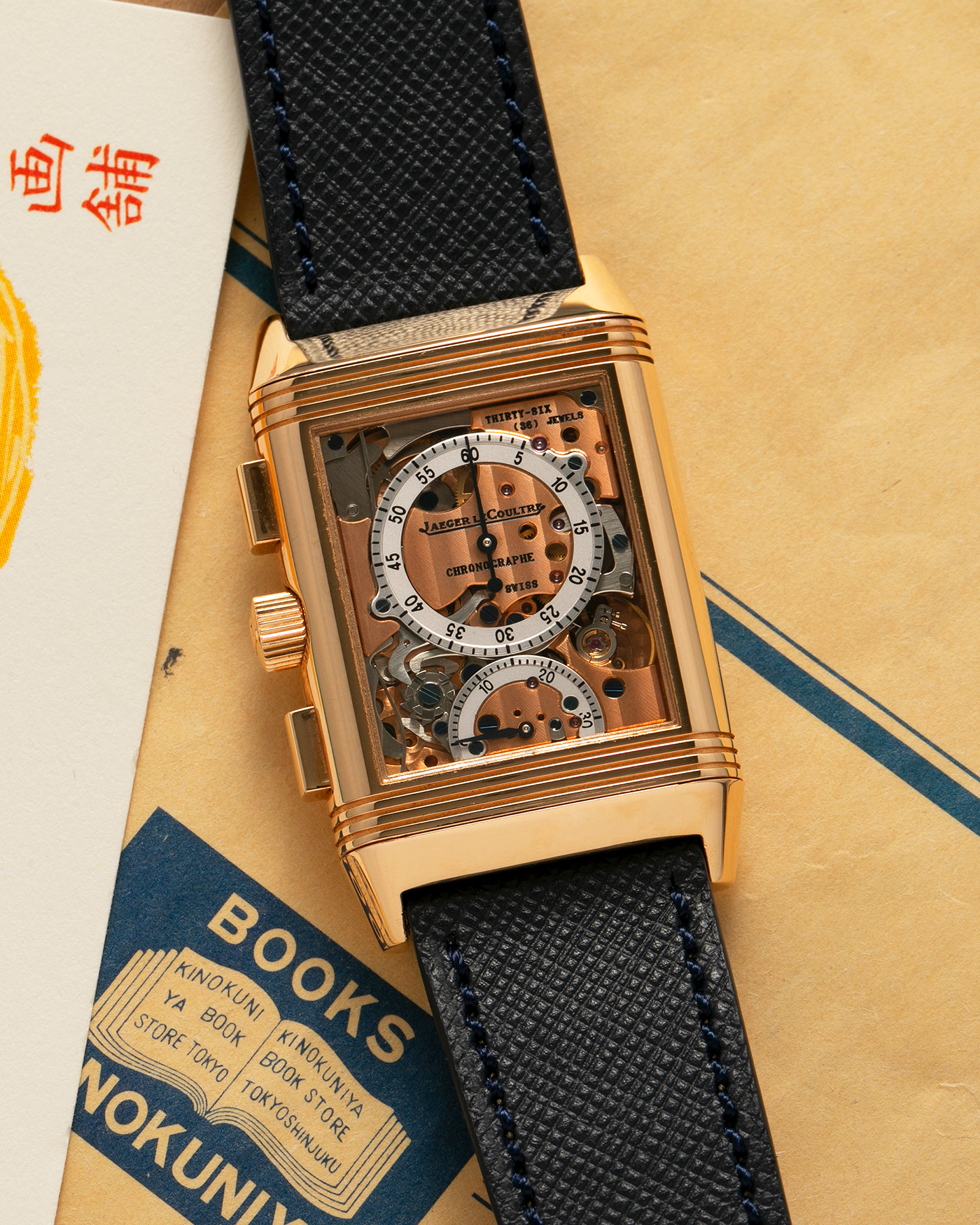 Brand: Jaeger LeCoultre Year: 1996 Model: Reverso Chronographe Retrograde, Limited to 500 pieces Reference: 270.2.69 Material: 18-carat Rose Gold Movement: Jaeger LeCoultre Cal. 829, Manual-Wind Case Dimensions: 42mm x 26mm x 9.5mm Lug Width: 19mm Strap: Molequin Navy Blue Textured Calf with Signed 18-carat Rose Gold Deployant Clasp
