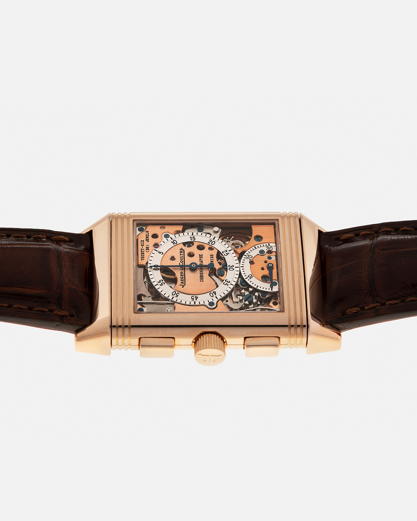 Brand: Jaeger LeCoultre
Year: 1996
Model: Reverso Chronographe Retrograde, Limited to 500 pieces
Reference: 270.2.69
Material: 18-carat Rose Gold
Movement: Jaeger LeCoultre Cal. 829, Manual-Winding
Case Dimensions: 42mm (including lugs) x 26mm x 9.5mm
Lug Width: 19mm
Strap: Jean Rosseau Brown Alligator Leather Strap with Signed 18-carat Rose Gold Deployant Clasp