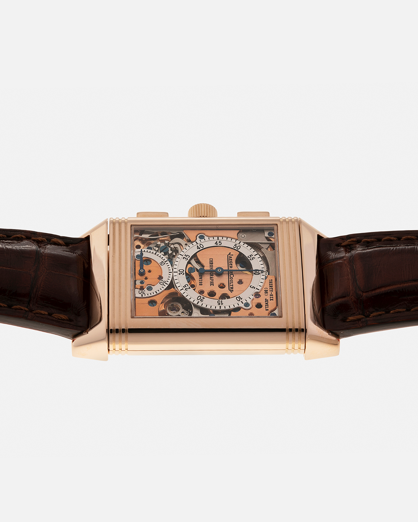Brand: Jaeger LeCoultre
Year: 1996
Model: Reverso Chronographe Retrograde, Limited to 500 pieces
Reference: 270.2.69
Material: 18-carat Rose Gold
Movement: Jaeger LeCoultre Cal. 829, Manual-Winding
Case Dimensions: 42mm (including lugs) x 26mm x 9.5mm
Lug Width: 19mm
Strap: Jean Rosseau Brown Alligator Leather Strap with Signed 18-carat Rose Gold Deployant Clasp
