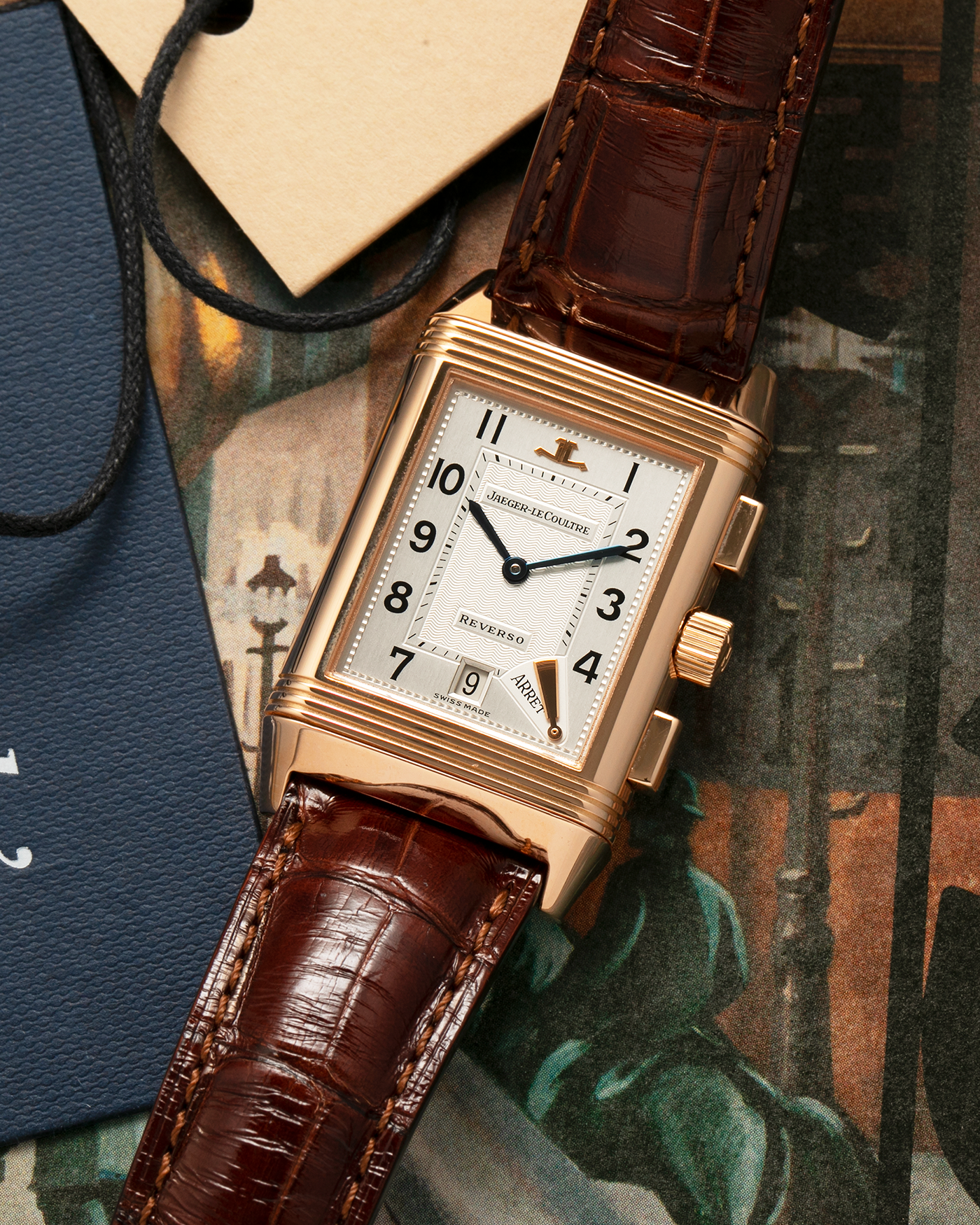 Brand: Jaeger LeCoultre
Year: 1996
Model: Reverso Chronographe Retrograde, Limited to 500 pieces
Reference: 270.2.69
Material: 18-carat Rose Gold
Movement: Jaeger LeCoultre Cal. 829, Manual-Winding
Case Dimensions: 42mm (including lugs) x 26mm x 9.5mm
Lug Width: 19mm
Strap: Jean Rosseau Brown Alligator Leather Strap with Signed 18-carat Rose Gold Deployant Clasp