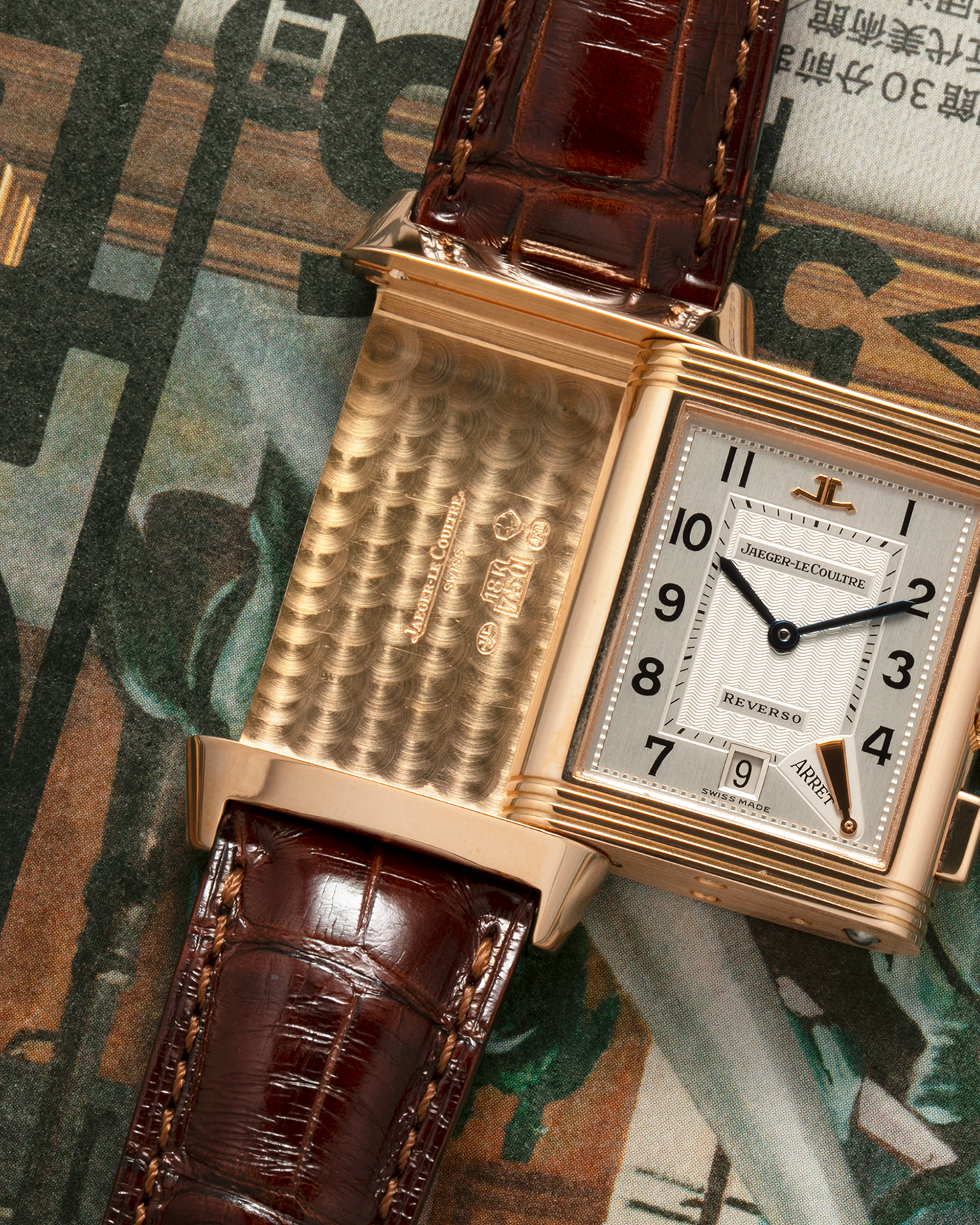 Brand: Jaeger LeCoultre
Year: 1996
Model: Reverso Chronographe Retrograde, Limited to 500 pieces
Reference: 270.2.69
Material: 18-carat Rose Gold
Movement: Jaeger LeCoultre Cal. 829, Manual-Winding
Case Dimensions: 42mm (including lugs) x 26mm x 9.5mm
Lug Width: 19mm
Strap: Jean Rosseau Brown Alligator Leather Strap with Signed 18-carat Rose Gold Deployant Clasp