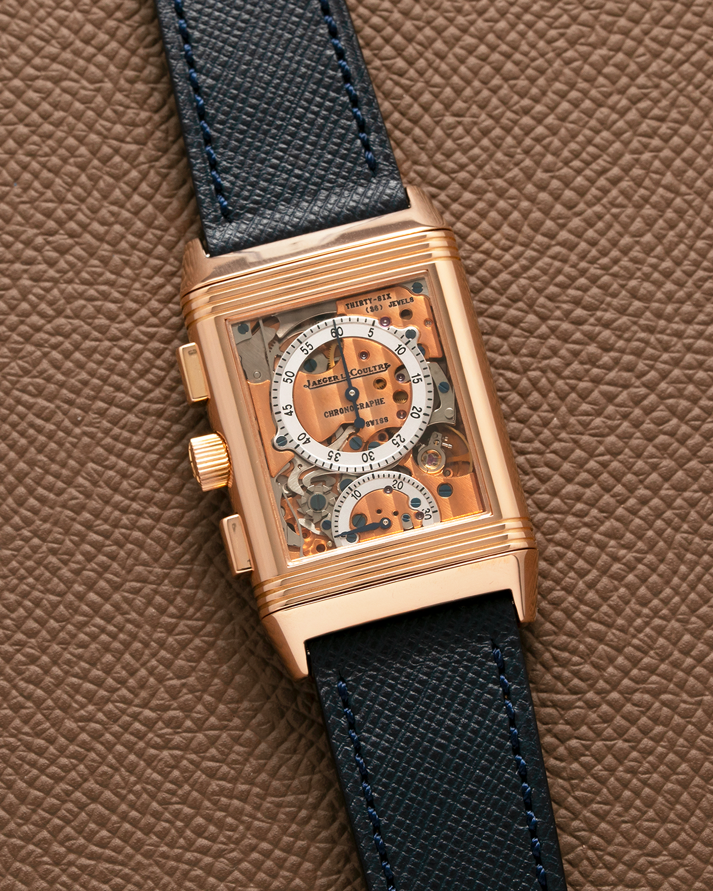 Brand: Jaeger LeCoultre Year: 1996 Model: Reverso Chronographe Retrograde, Limited to 500 pieces Reference: 270.2.69 Material: 18-carat Rose Gold Movement: JLC Cal. 829, Manual-Wind Case Diameter: 42mm x 26mm x 9.5mm Strap: Molequin Navy Blue Textured Calf with Signed 18-carat Rose Gold Deployant Clasp