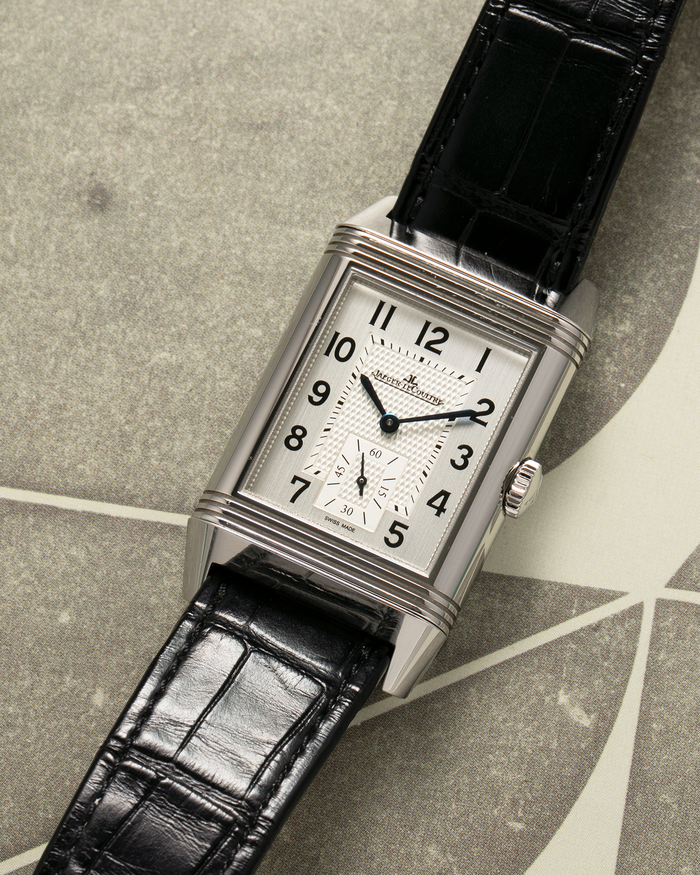 Brand: Jaeger LeCoultre Year: 2020 Model: Reverso Classic Large Duoface Q3848422 Reference Number: 215.8.D4 Material: Stainless Steel Movement: Jaeger LeCoultre Cal. 854A/2, Manual-Wind Case Dimensions: 47mm x 28.3mm x 10.3mm Lug Width: 20mm Strap: Jaeger LeCoultre Case Black Alligator Leather Strap with Signed Stainless Steel Deployant Buckle