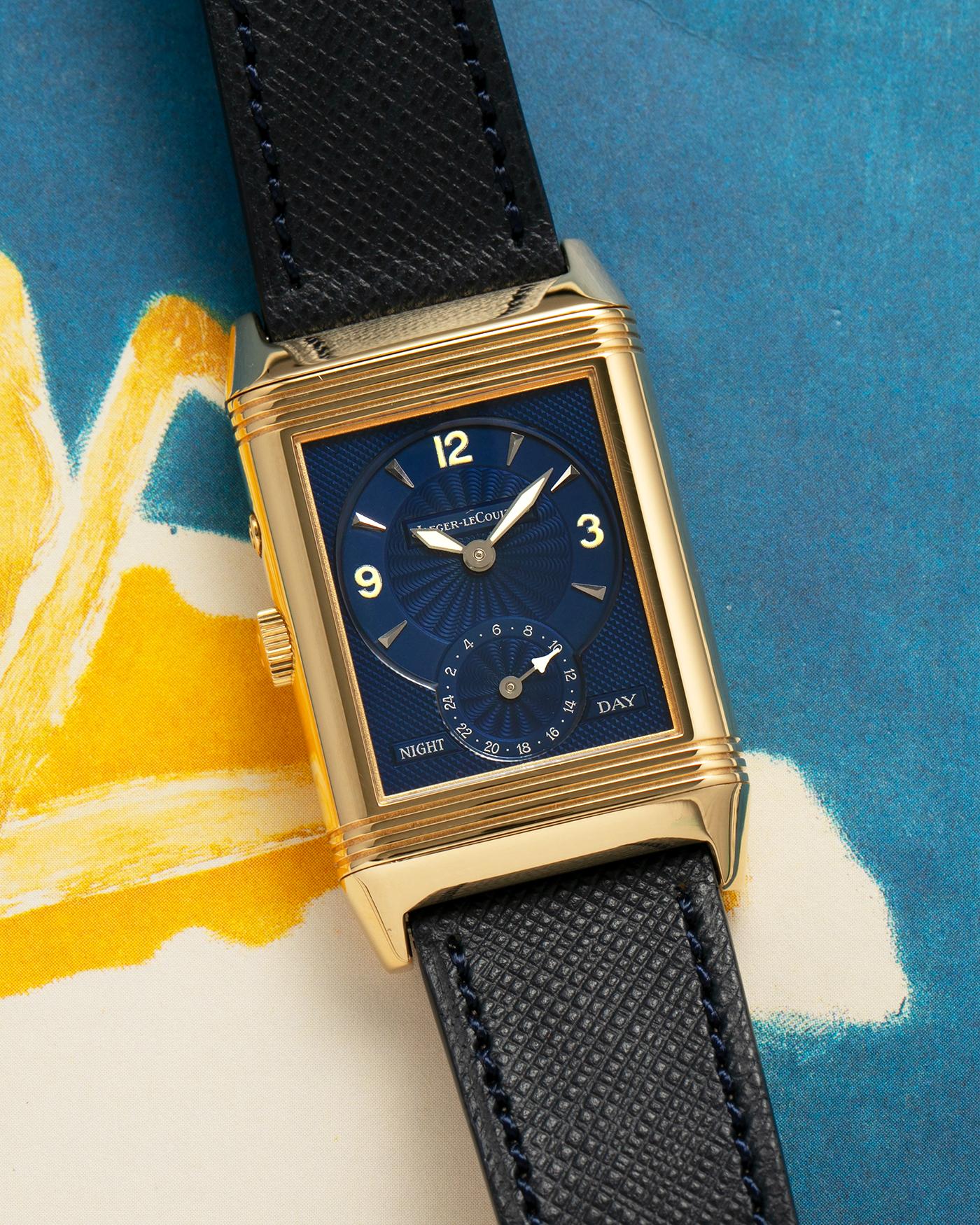 Brand: Jaeger LeCoultre Year: 2000s Model: Reverso Duoface Japan Edition Blue, Limited Edition of 39 Pieces Reference Number: 270.1.54 Case Material: 18-carat Yellow Gold Movement: Jaeger LeCoultre Cal. 854, Manual-Wind Case Diameter: 42mm x 26mm Lug Width: 19mm Strap: Molequin Navy Blue Textured Calf Leather Strap with Signed 1-carat Yellow Gold Deployant Clasp, with additional Jaeger LeCoultre Black Alligator Leather Strap (Used)