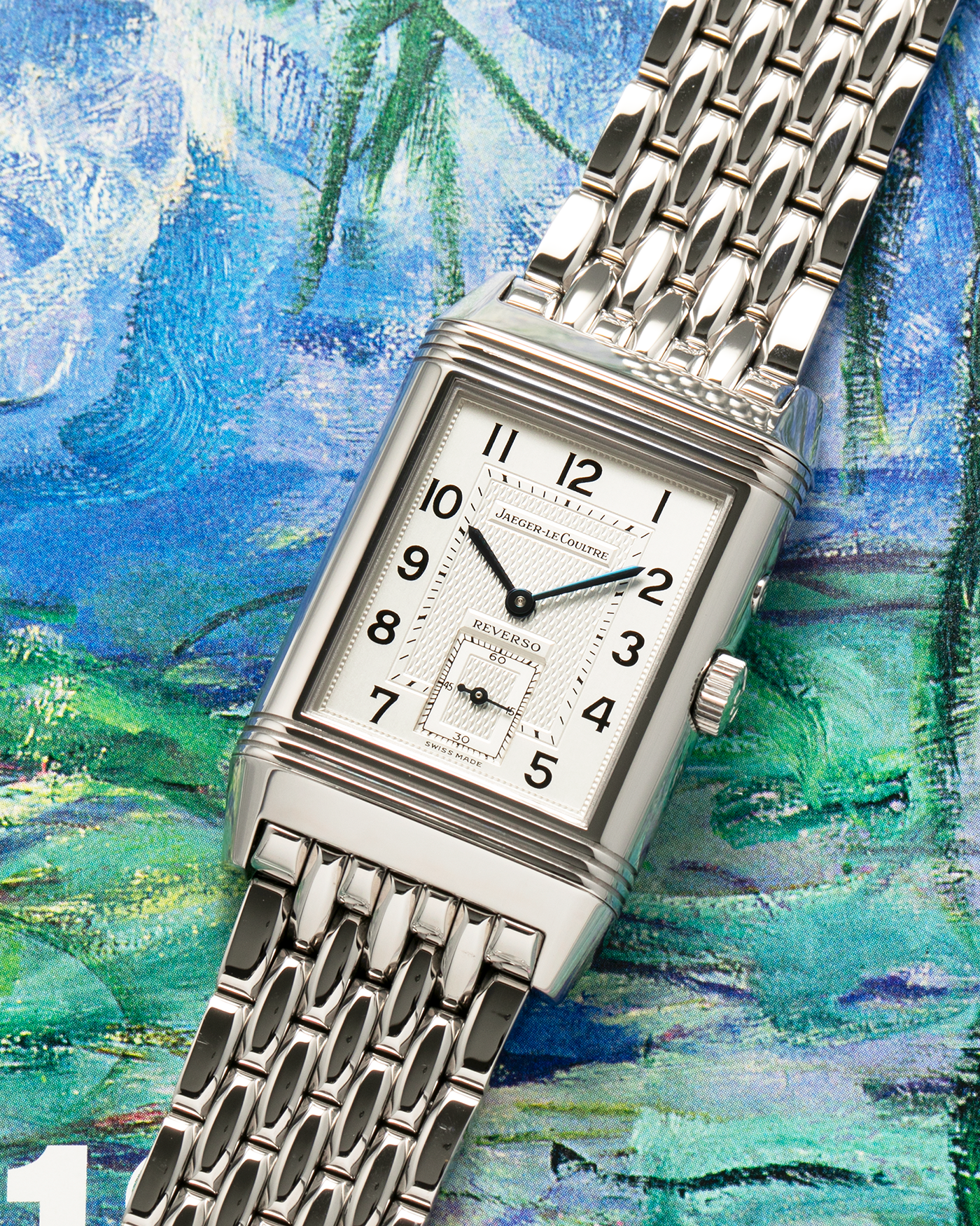 Brand: Jaeger LeCoultre
Year: 1999
Model: Reverso Duoface Japan Edition Green, Limited Edition of 300 Pieces
Reference Number: 270.8.54
Material: Stainless Steel
Movement: Jaeger LeCoultre Cal. 854, Manual-Winding
Case Dimensions: 42mm (Including Lugs) x 26mm x 9.5mm
Lug Width: 19mm
Bracelet: Jaeger LeCoultre Stainless Steel Bracelet With Signed Clasp