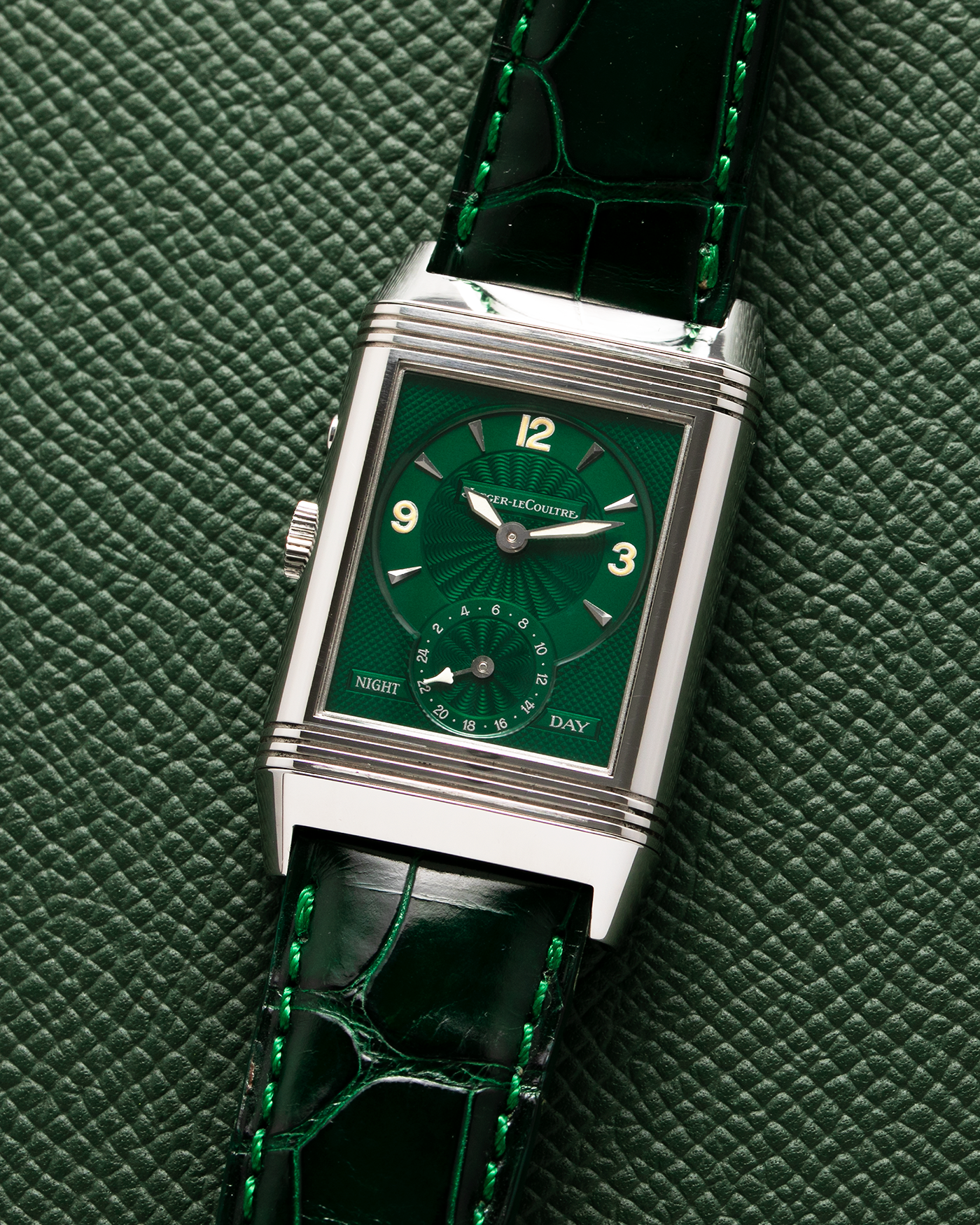 Brand: Jaeger-LeCoultre Year: 1999 Model: Reverso Duo Serie Premier, Ref. 270.8.54 Green Japan Edition Material: Stainless Steel Movement: Cal. 854, Manual-Wind Case Diameter: 42 x 26mm Bracelet/Strap: Emerald Green Crocodile Leather Strap with Signed Stainless Steel Deployant Clasp