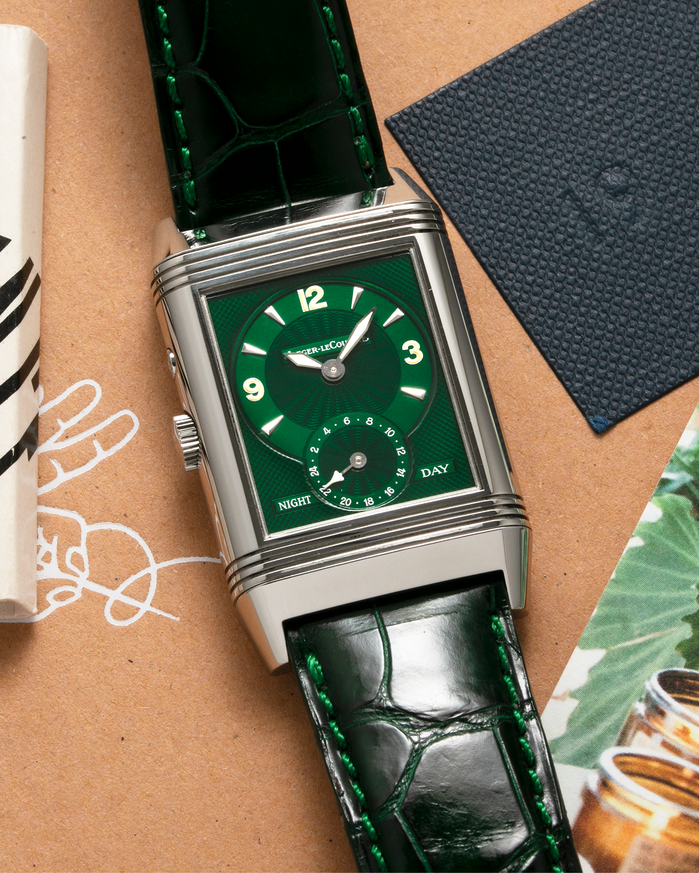 Brand: Jaeger-LeCoultre Year: 1999 Model: Reverso Duo Serie Premier, Ref. 270.8.54 Green Japan Edition Material: Stainless Steel Movement: Cal. 854, Manual-Wind Case Diameter: 42 x 26mm Bracelet/Strap: Emerald Green Crocodile Leather Strap with Signed Stainless Steel Deployant Clasp