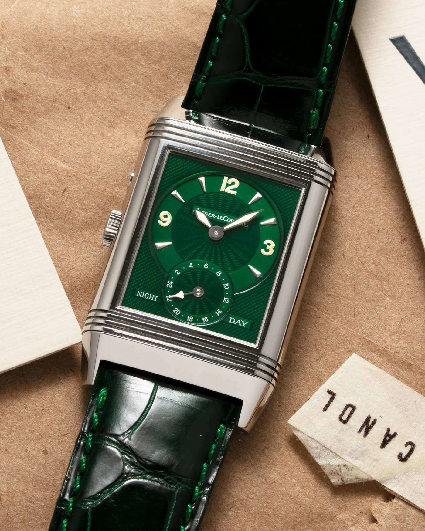 Brand: Jaeger-LeCoultre Year: 1999 Model: Reverso Duo Serie Premier, Ref. 270.8.54 Green Japan Edition Material: Stainless Steel Movement: Cal. 854, Manual-Wind Case Diameter: 42 x 26mm Bracelet/Strap: Emerald Green Crocodile Leather Strap with Signed Stainless Steel Deployant Clasp