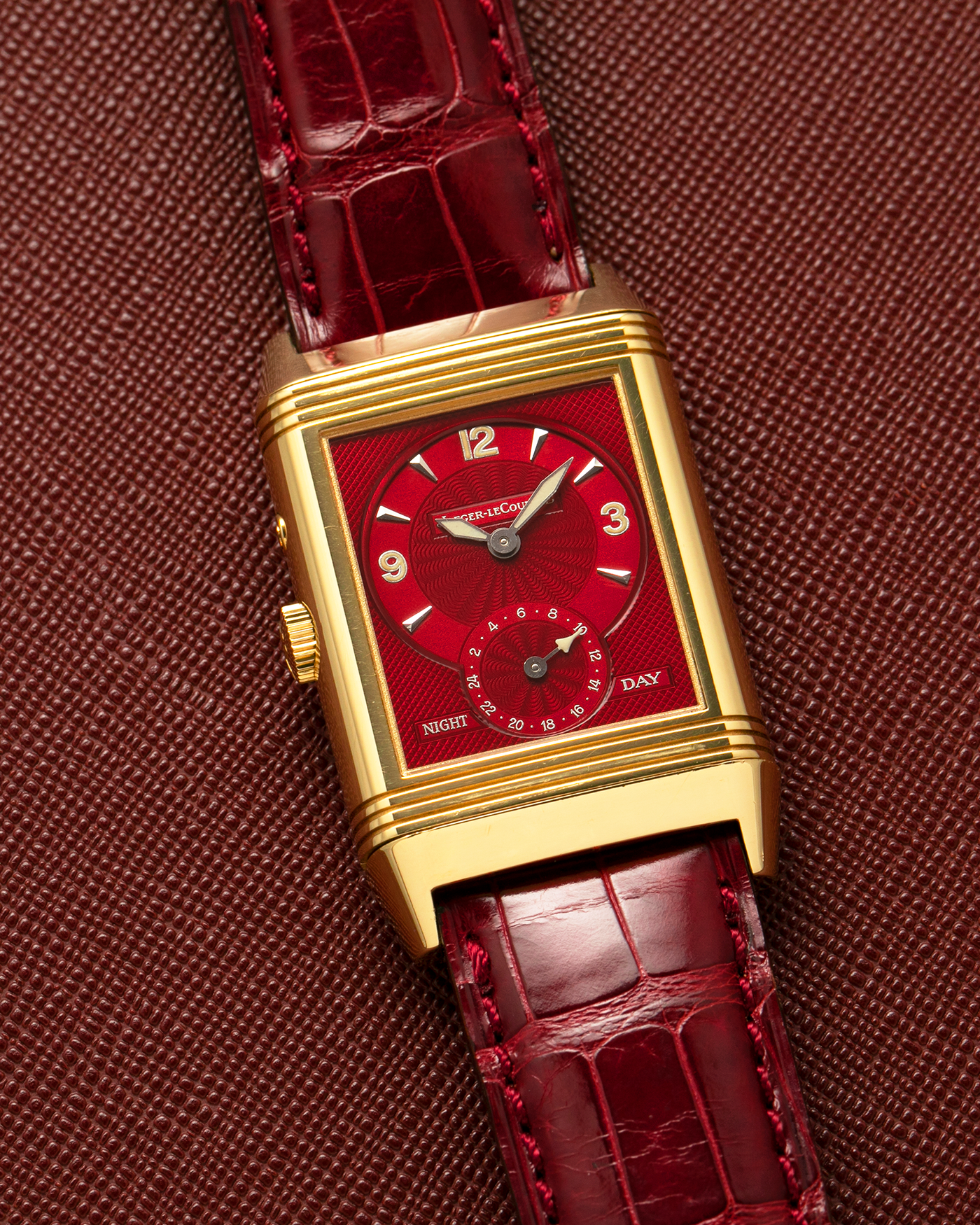 Brand: Jaeger LeCoultre
Year: 1999
Model: Reverso Duoface Japan Edition Red, Limited Edition of 39 Pieces
Reference Number: 270.1.54
Material: 18-carat Yellow Gold
Movement: Jaeger LeCoultre Cal. 854, Manual-Wind
Case Dimensions: 42mm (Including Lugs) x 26mm
Lug Width: 19mm
Strap: Jaeger LeCoultre Burgundy Red Alligator Leather Strap with Signed 18-carat Yellow Gold Tang Buckle