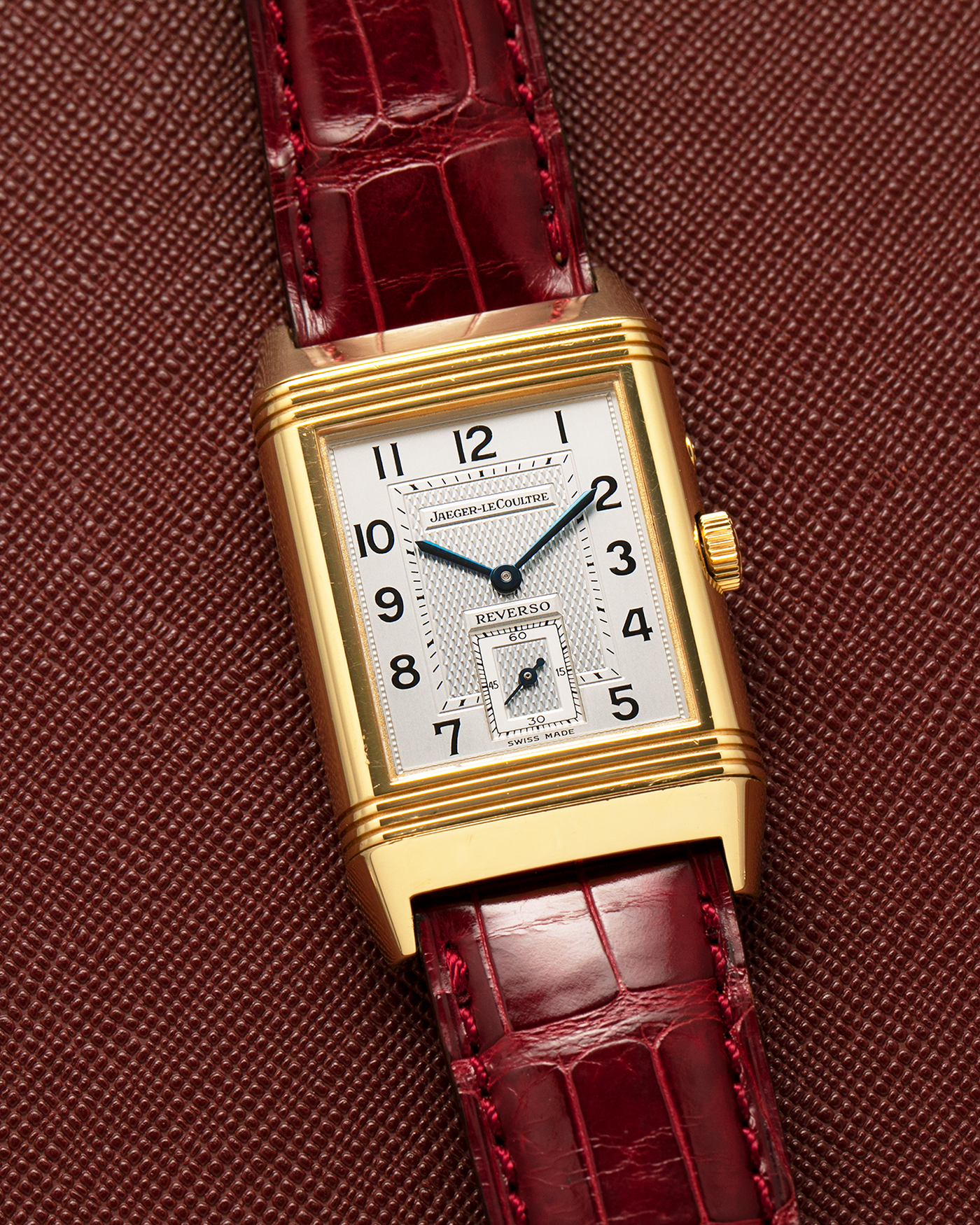 Brand: Jaeger LeCoultre
Year: 1999
Model: Reverso Duoface Japan Edition Red, Limited Edition of 39 Pieces
Reference Number: 270.1.54
Material: 18-carat Yellow Gold
Movement: Jaeger LeCoultre Cal. 854, Manual-Wind
Case Dimensions: 42mm (Including Lugs) x 26mm
Lug Width: 19mm
Strap: Jaeger LeCoultre Burgundy Red Alligator Leather Strap with Signed 18-carat Yellow Gold Tang Buckle