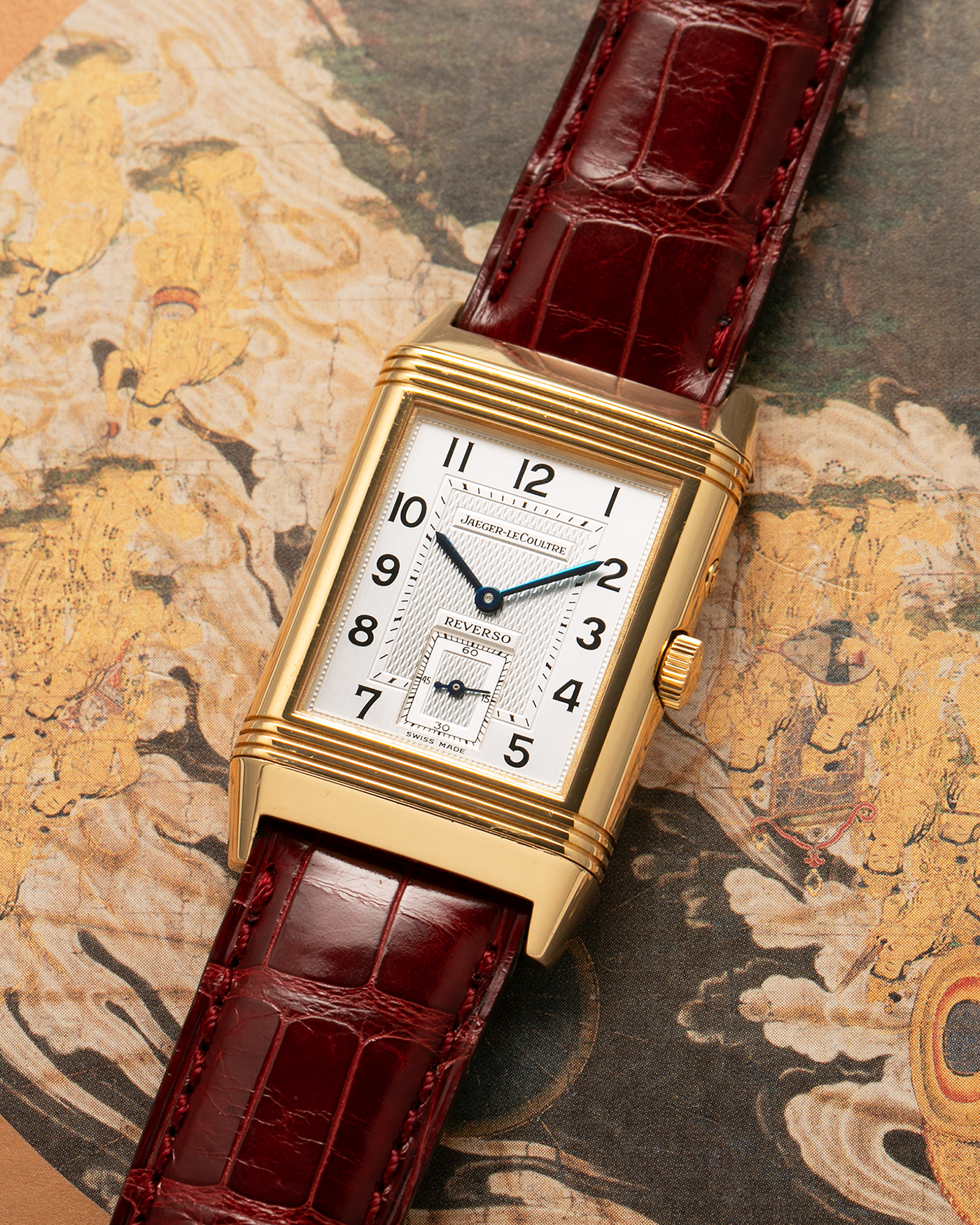 Brand: Jaeger LeCoultre
Year: 1999
Model: Reverso Duoface Japan Edition Red, Limited Edition of 39 Pieces
Reference Number: 270.1.54
Material: 18-carat Yellow Gold
Movement: Jaeger LeCoultre Cal. 854, Manual-Wind
Case Dimensions: 42mm (Including Lugs) x 26mm
Lug Width: 19mm
Strap: Jaeger LeCoultre Burgundy Red Alligator Leather Strap with Signed 18-carat Yellow Gold Tang Buckle