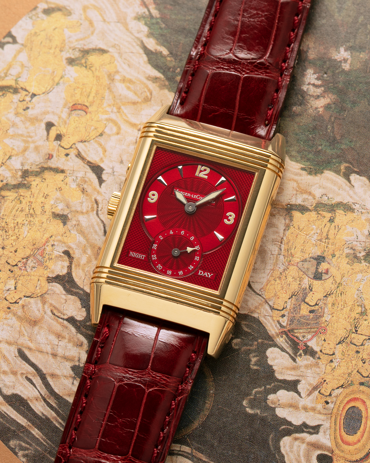 Brand: Jaeger LeCoultre
Year: 1999
Model: Reverso Duoface Japan Edition Red, Limited Edition of 39 Pieces
Reference Number: 270.1.54
Material: 18-carat Yellow Gold
Movement: Jaeger LeCoultre Cal. 854, Manual-Wind
Case Dimensions: 42mm (Including Lugs) x 26mm
Lug Width: 19mm
Strap: Jaeger LeCoultre Burgundy Red Alligator Leather Strap with Signed 18-carat Yellow Gold Tang Buckle