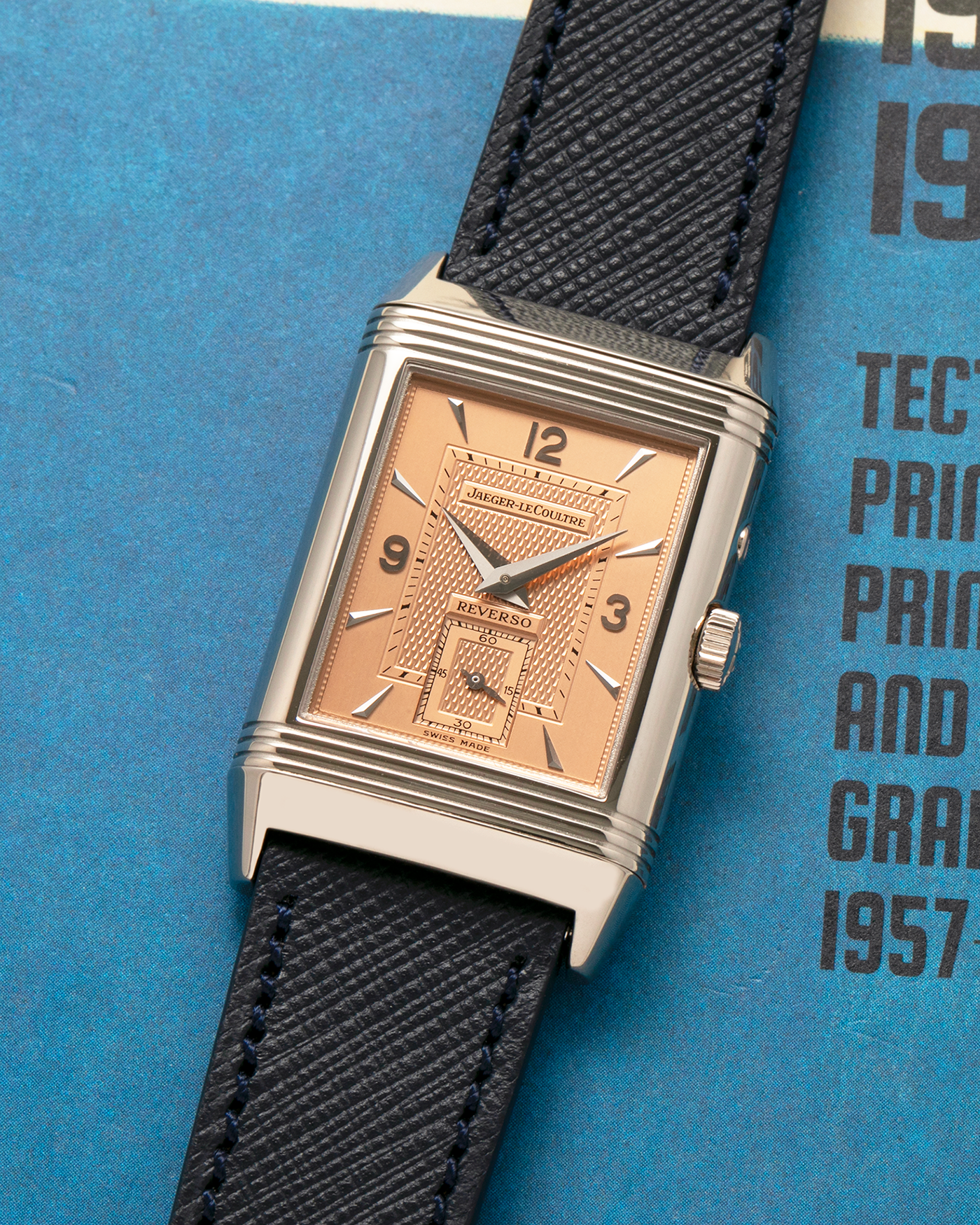 Brand: Jaeger LeCoultre
Year: 1990s
Model: Reverso Duoface Japan Edition, Limited Edition of 250 pieces
Reference: 270.0.54A
Material: 18-carat White Gold, 18-carat Rose Gold
Movement: Jaeger LeCoultre Cal. 854, Manual-Wind
Case Dimensions: 42mm (Including Lugs) x 26mm
Lug Width: 19mm
Strap: Molequin Dark Navy Textured Calf Leather Strap with Signed 18-carat White Gold Deployant Clasp