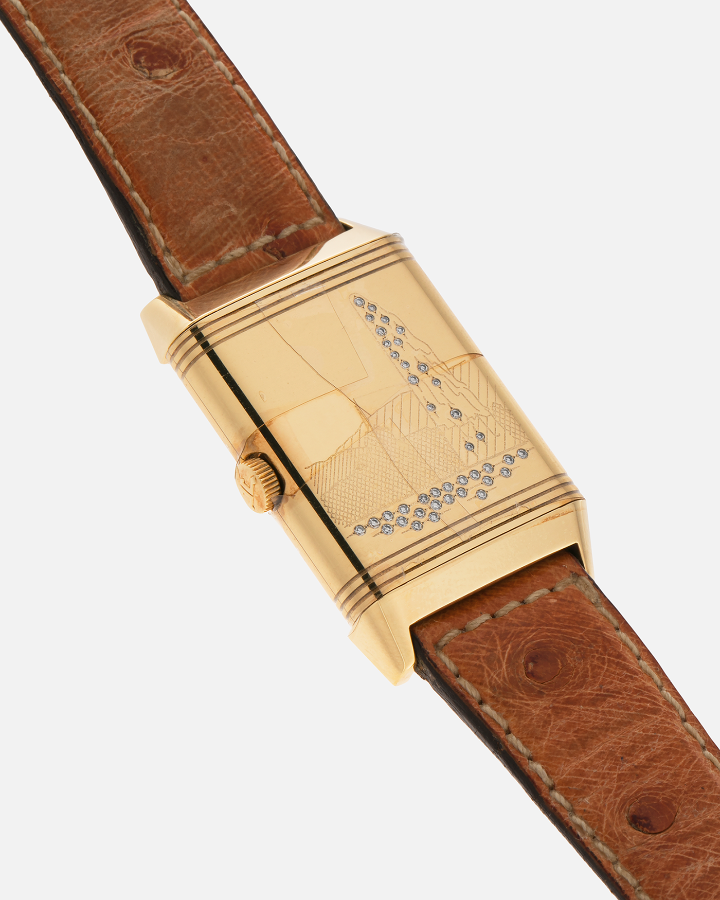 Brand: Jaeger LeCoultre
Year: 1995
Model: Reverso Geneva Fountain / Cathedral Saint-Pierre
Reference: 275.1.62 / 275.142.626 YG
Material: 18k Yellow Gold
Movement: Jaeger LeCoultre Cal. 852, Manual-Winding
Case Dimensions: 42mm X 26mm (10mm Thickness)
Lug Width: 19mm
Strap: Brown Jaeger-LeCoutre Ostrich Leather Strap with Jaeger-LeCoultre 18k Yellow Gold Tang Buckle