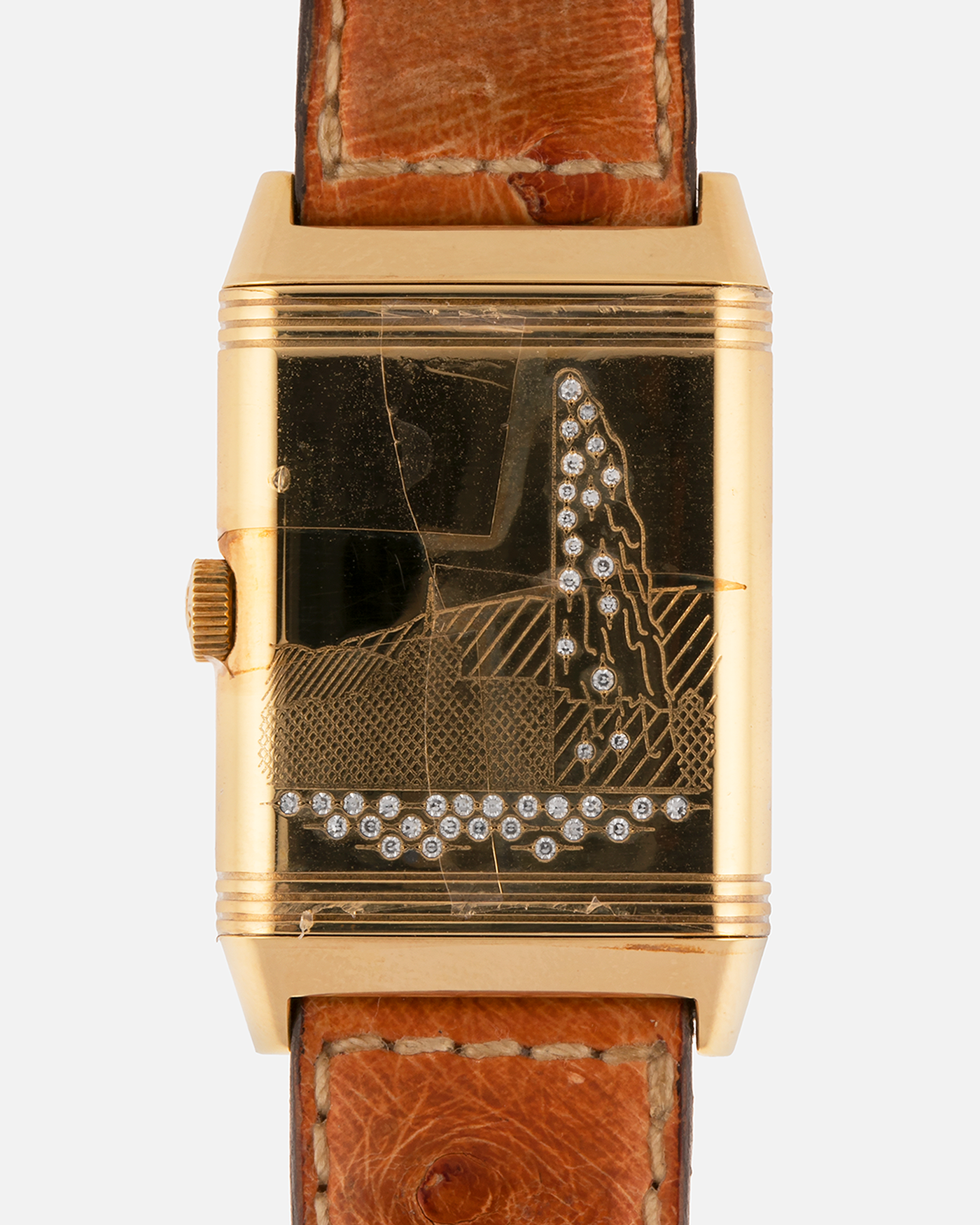 Brand: Jaeger LeCoultre
Year: 1995
Model: Reverso Geneva Fountain / Cathedral Saint-Pierre
Reference: 275.1.62 / 275.142.626 YG
Material: 18k Yellow Gold
Movement: Jaeger LeCoultre Cal. 852, Manual-Winding
Case Dimensions: 42mm X 26mm (10mm Thickness)
Lug Width: 19mm
Strap: Brown Jaeger-LeCoutre Ostrich Leather Strap with Jaeger-LeCoultre 18k Yellow Gold Tang Buckle