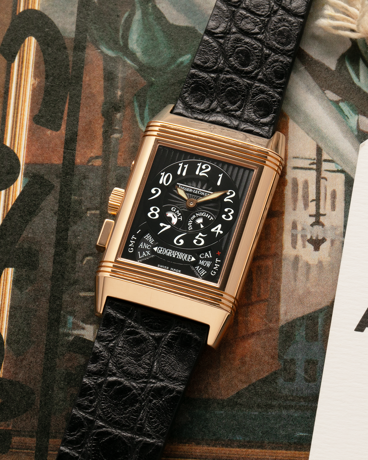 Brand: Jaeger LeCoultre
Year: 1998
Model: Reverso Géographique World Time Duoface, Limited to 500 pieces
Reference: 270.2.58
Material: 18k Rose Gold
Movement: Jaeger LeCoultre Cal. 858, Manual-Winding
Case Dimensions: 42mm (Including Lugs) x 26mm x 10mm
Lug Width: 19mm
Strap: Black Handdn Round-Scale Alligator Leather Strap with Jaeger-LeCoultre 18k Rose Gold Deployant Clasp