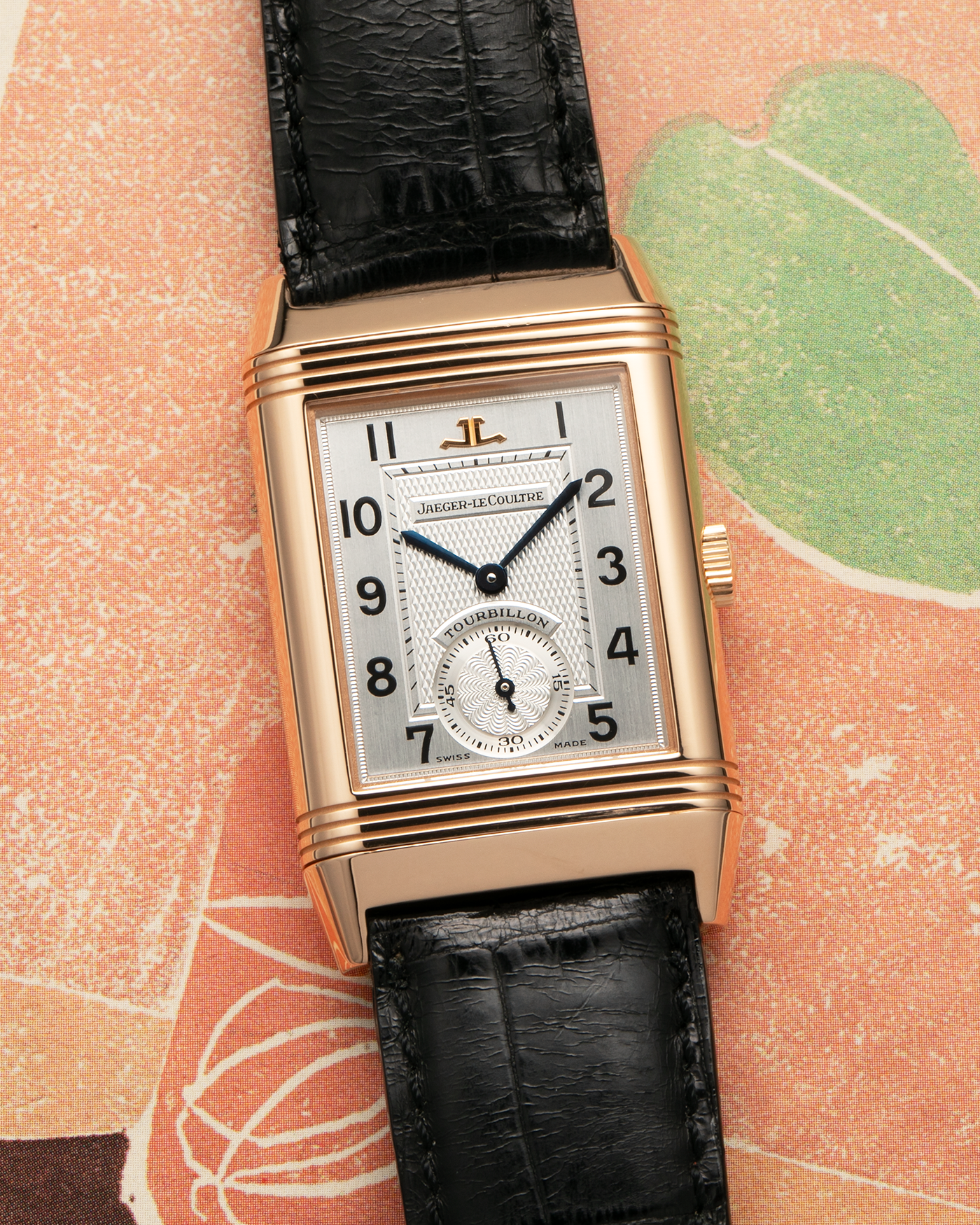 Brand: Jaeger LeCoultre
Year: 1990s
Model: Reverso Tourbillon, Limited to 500 pieces
Reference: 270.2.68
Material: 18-carat Rose Gold
Movement: Jaeger LeCoultre Cal. 828, Manual-Winding
Case Dimensions: 42mm (Including Lugs) x 26mm x 10mm
Lug Width: 19mm
Strap: Jaeger LeCoultre Black Alligator Leather Strap with Signed 18-carat Rose Gold Deployant Clasp