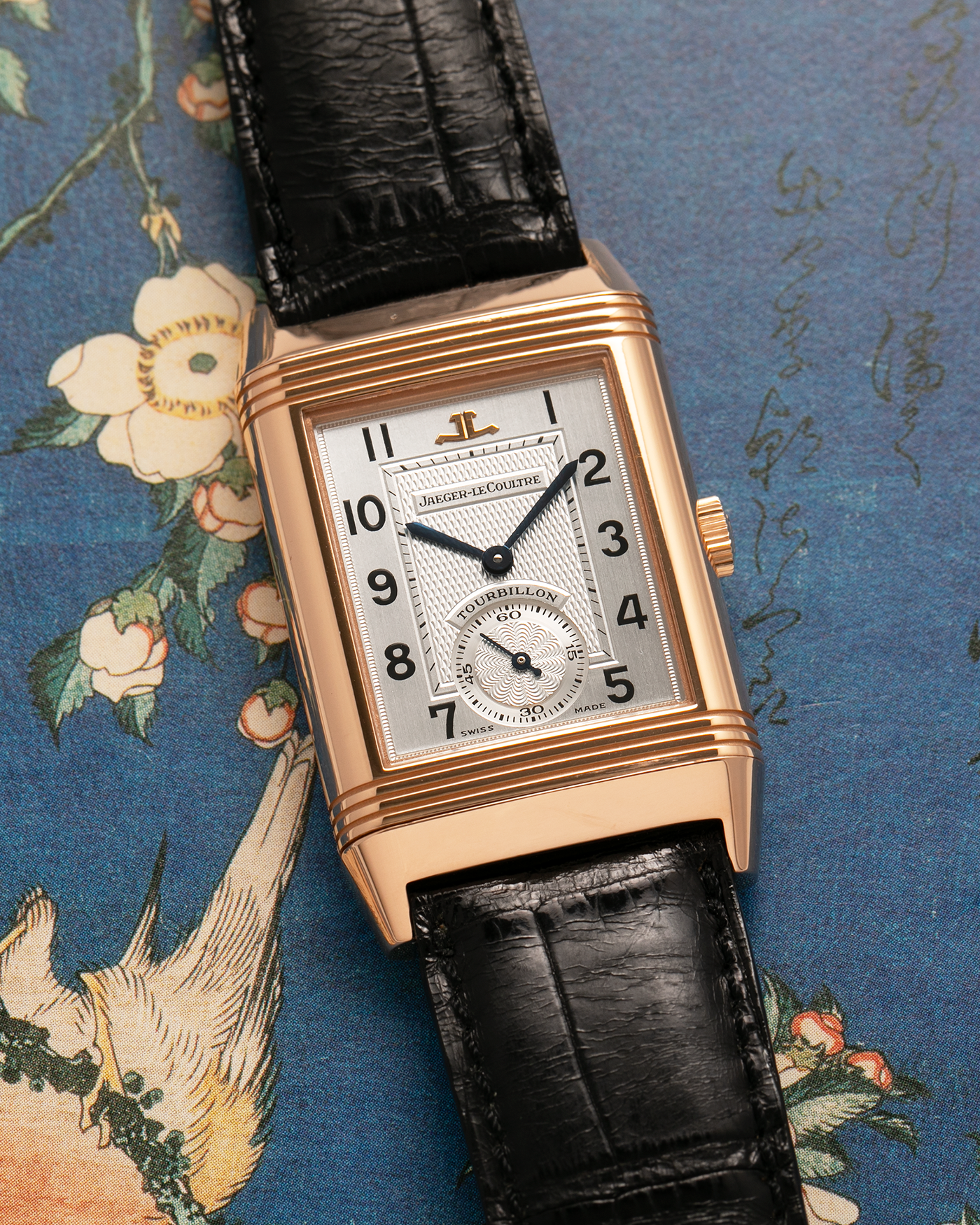 Brand: Jaeger LeCoultre
Year: 1990s
Model: Reverso Tourbillon, Limited to 500 pieces
Reference: 270.2.68
Material: 18-carat Rose Gold
Movement: Jaeger LeCoultre Cal. 828, Manual-Winding
Case Dimensions: 42mm (Including Lugs) x 26mm x 10mm
Lug Width: 19mm
Strap: Jaeger LeCoultre Black Alligator Leather Strap with Signed 18-carat Rose Gold Deployant Clasp