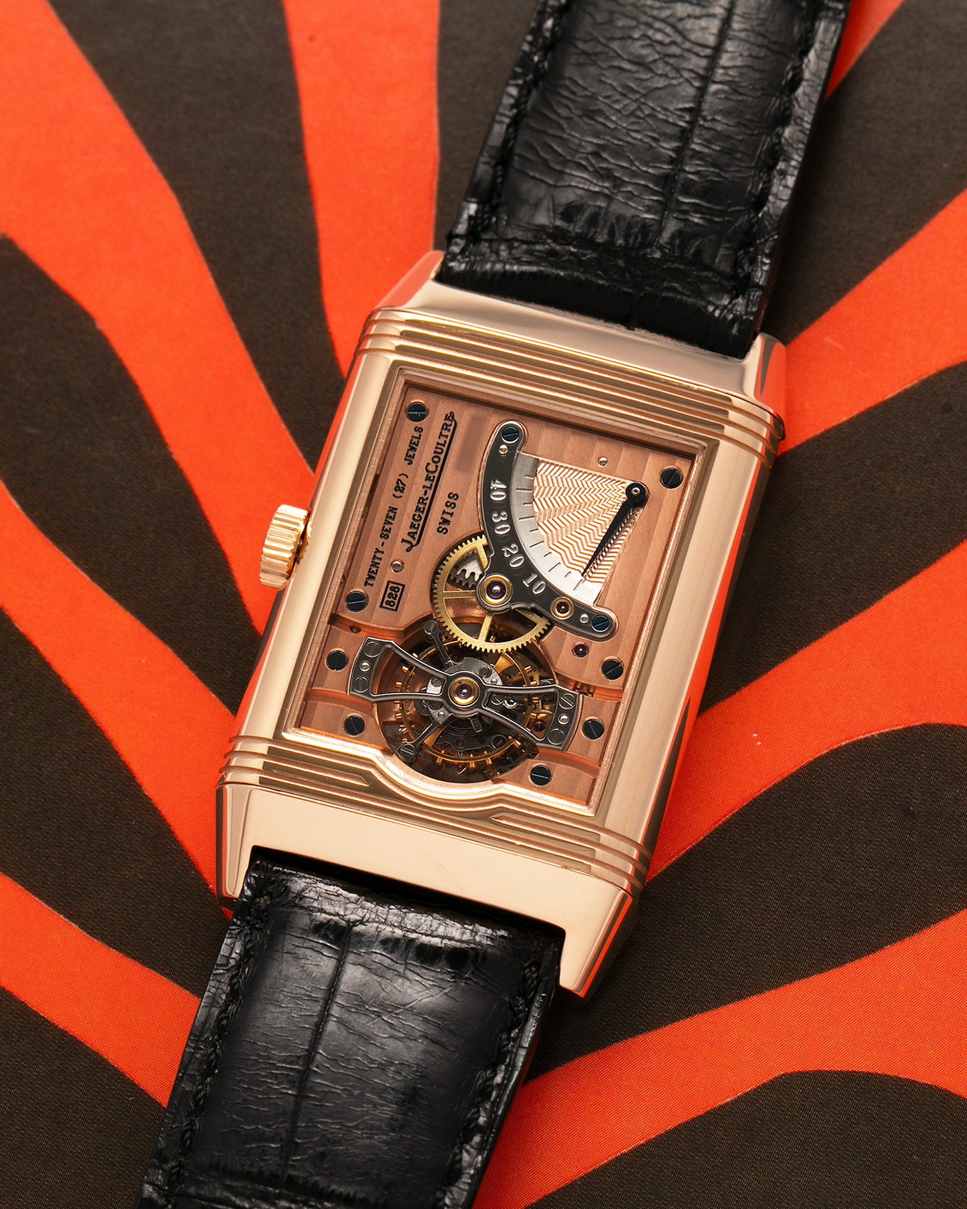 Brand: Jaeger LeCoultre
Year: 1990s
Model: Reverso Tourbillon, Limited to 500 pieces
Reference: 270.2.68
Material: 18-carat Rose Gold
Movement: Jaeger LeCoultre Cal. 828, Manual-Winding
Case Dimensions: 42mm (Including Lugs) x 26mm x 10mm
Lug Width: 19mm
Strap: Jaeger LeCoultre Black Alligator Leather Strap with Signed 18-carat Rose Gold Deployant Clasp
