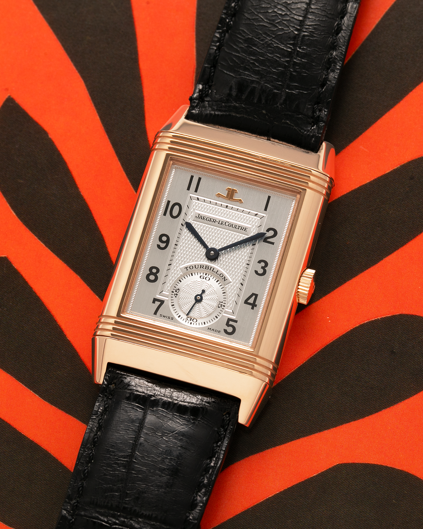 Brand: Jaeger LeCoultre
Year: 1990s
Model: Reverso Tourbillon, Limited to 500 pieces
Reference: 270.2.68
Material: 18-carat Rose Gold
Movement: Jaeger LeCoultre Cal. 828, Manual-Winding
Case Dimensions: 42mm (Including Lugs) x 26mm x 10mm
Lug Width: 19mm
Strap: Jaeger LeCoultre Black Alligator Leather Strap with Signed 18-carat Rose Gold Deployant Clasp